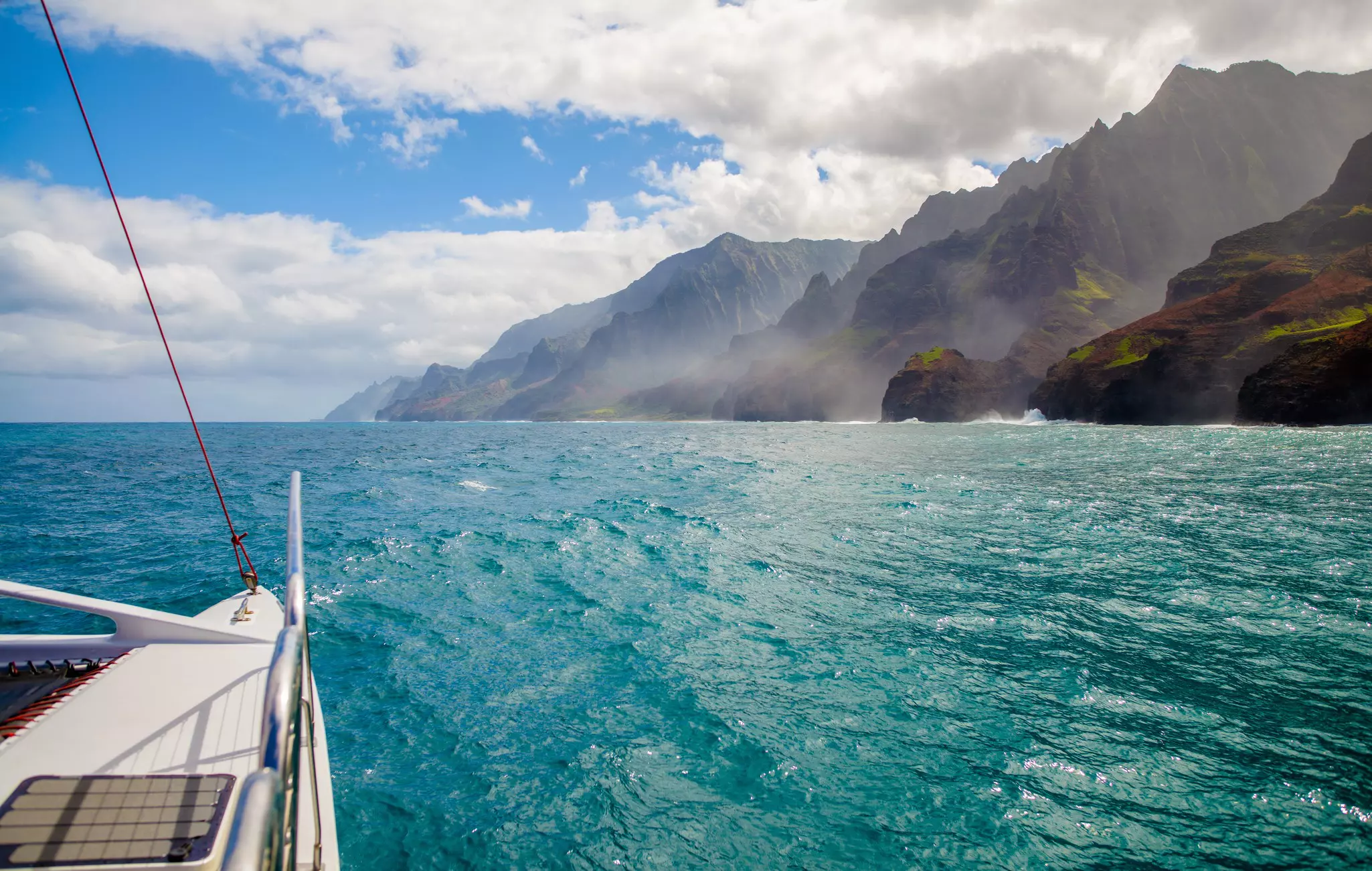 A sunny view of the Na Pali Coast from the water, Kauai, Hawaii