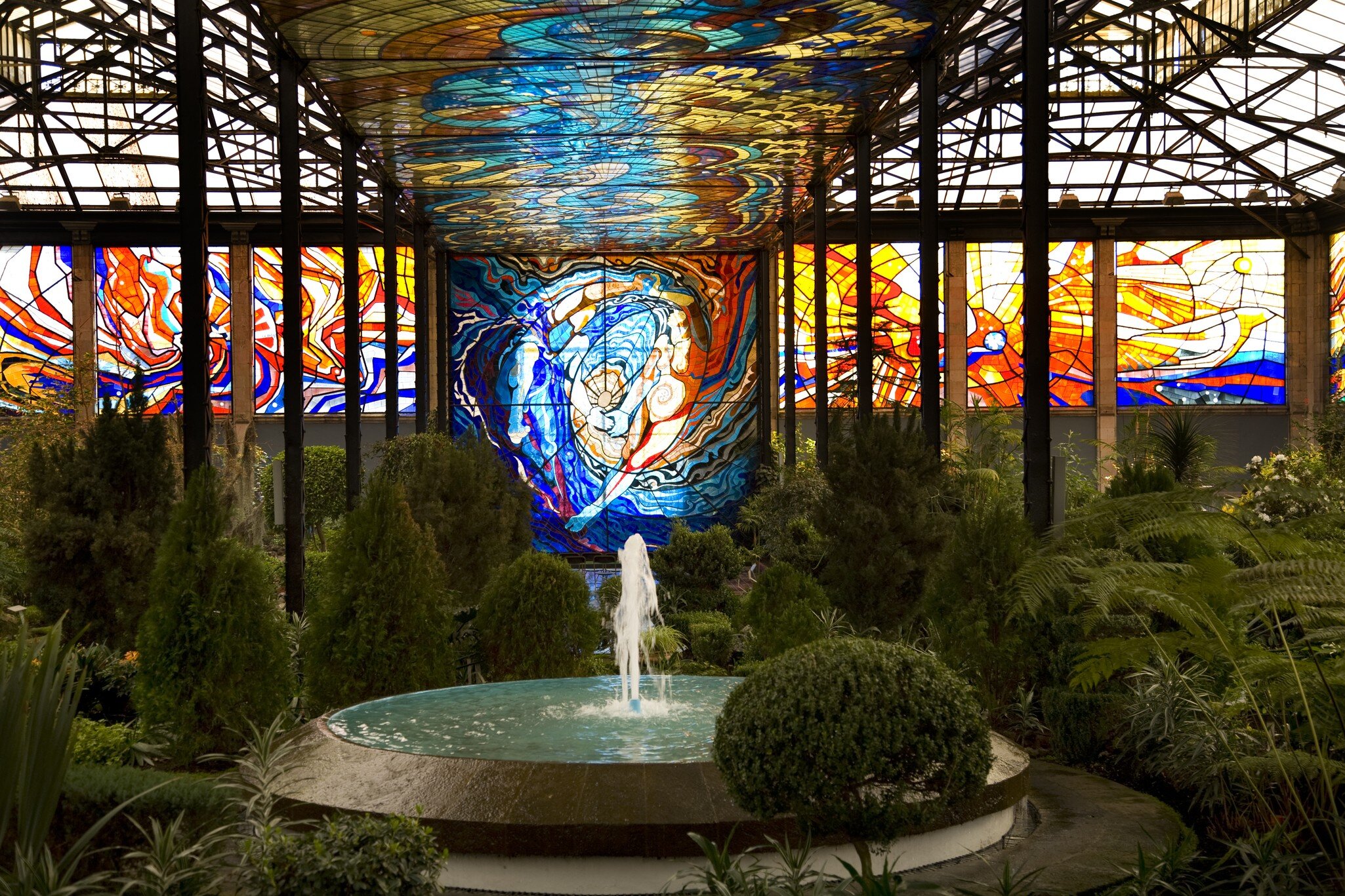 Cosmovitral Botanical Garden in Toluca, Mexico is surrounded by stained glass.  This side of the botanical garden represents chaos.; Shutterstock ID 9846277;