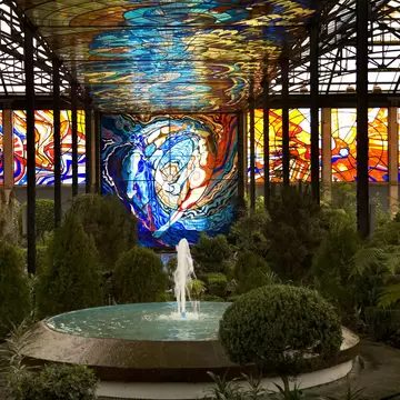 Cosmovitral Botanical Garden in Toluca, Mexico is surrounded by stained glass.  This side of the botanical garden represents chaos.; Shutterstock ID 9846277;