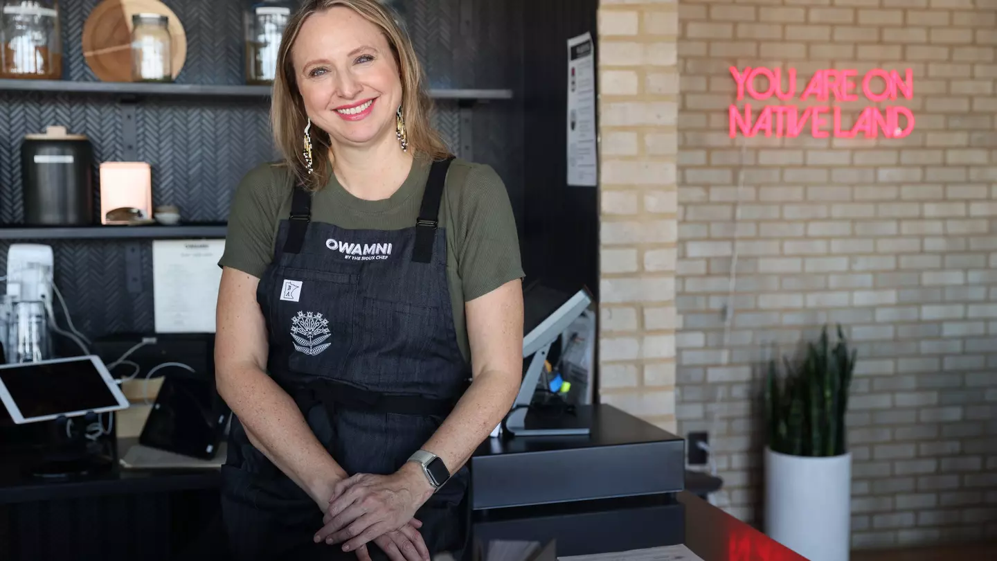 Dana Thompson at the hostess counter at Owamni