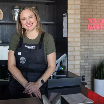 Dana Thompson at the hostess counter at Owamni