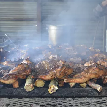 The smoky, spicy flavors of jerk chicken are a key part of Jamaican culture. petalouda/Shutterstock