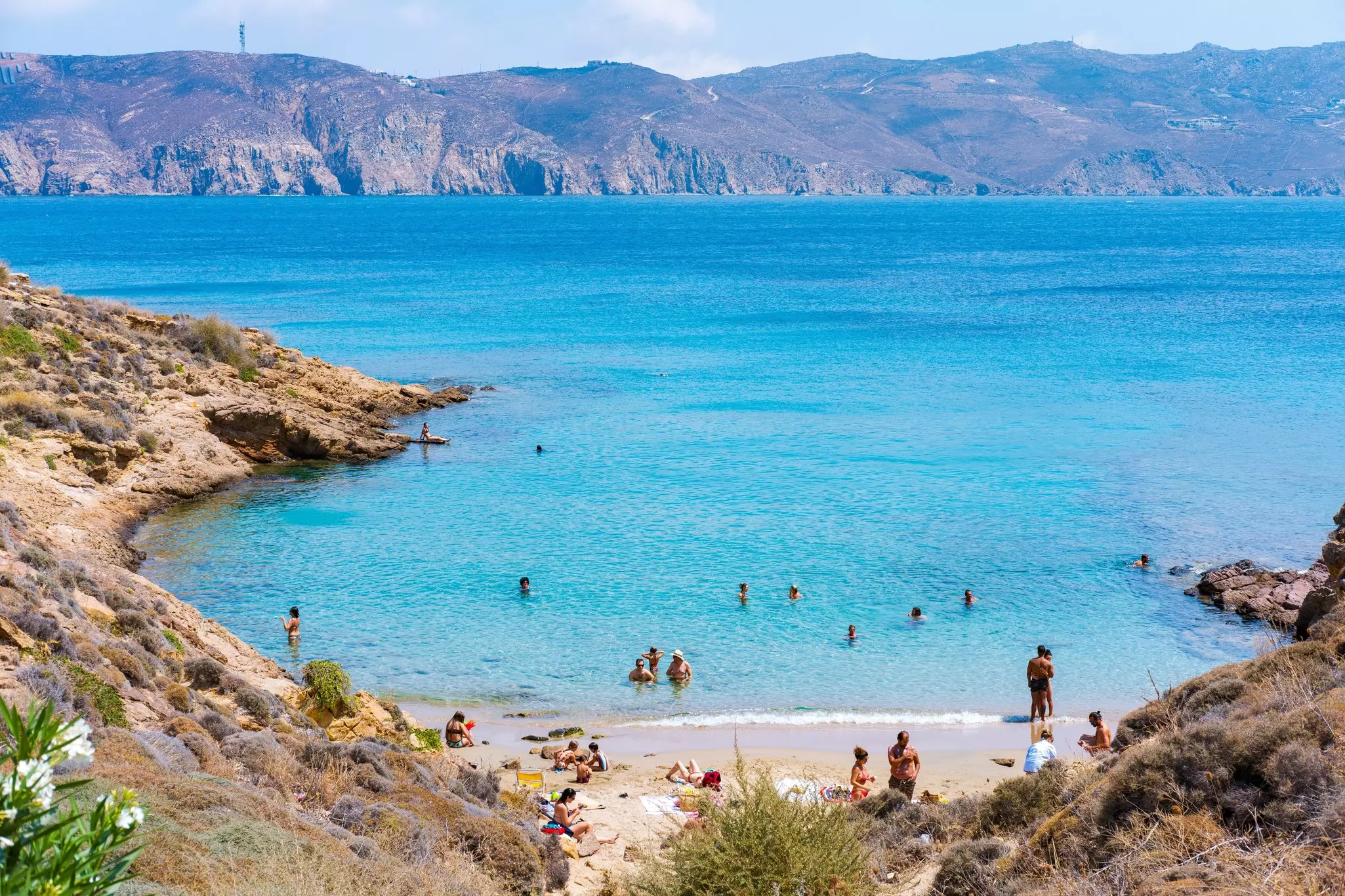Paralia Agios Sostis wild and free beach in the north of island. Pristine bay with blue sea and crystal water, famous for naturism and Kiki's Tavern, peaceful and quiet.