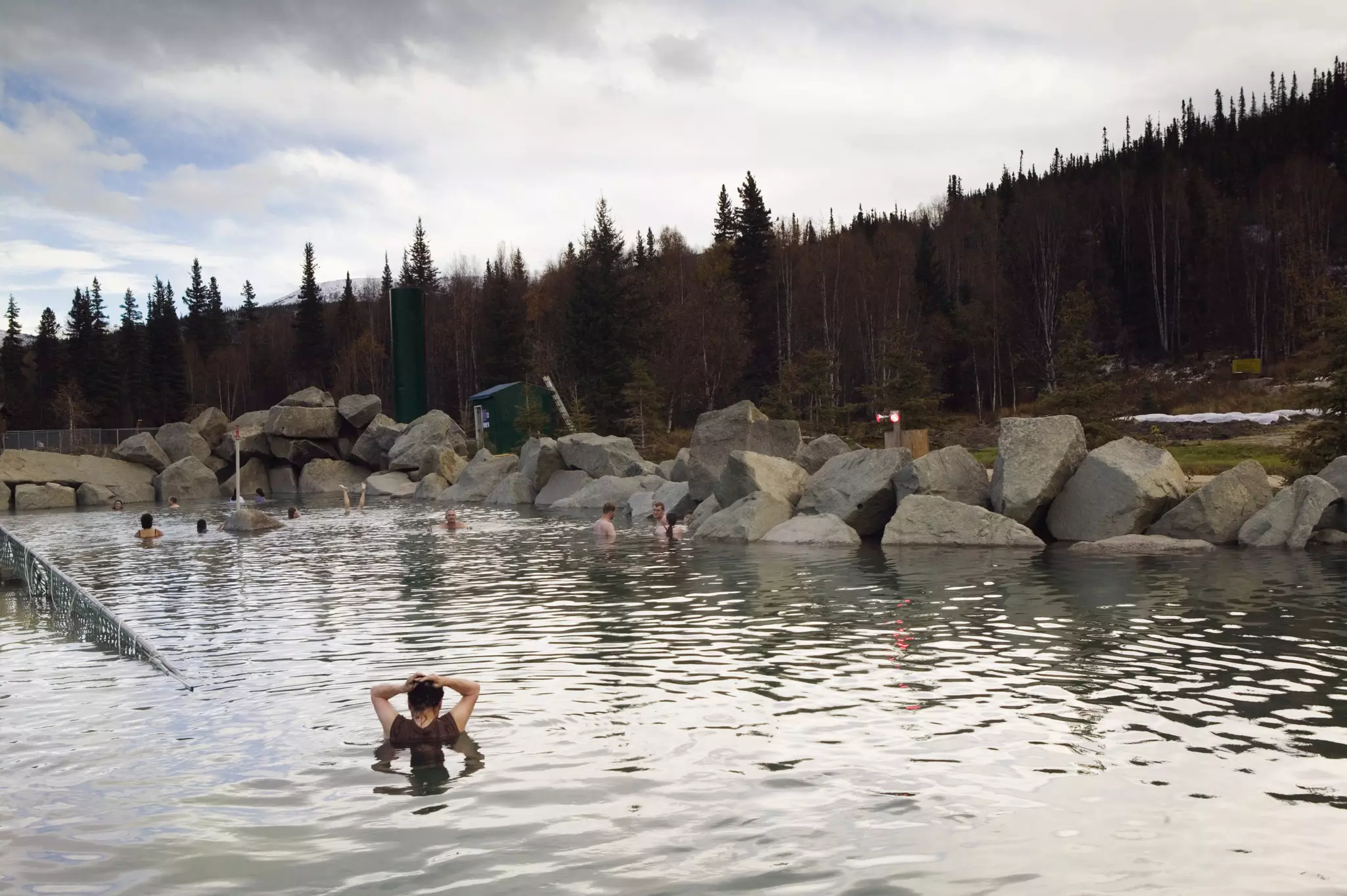 People soak in the naturally heated pools of Chena Hot Springs, Alaska