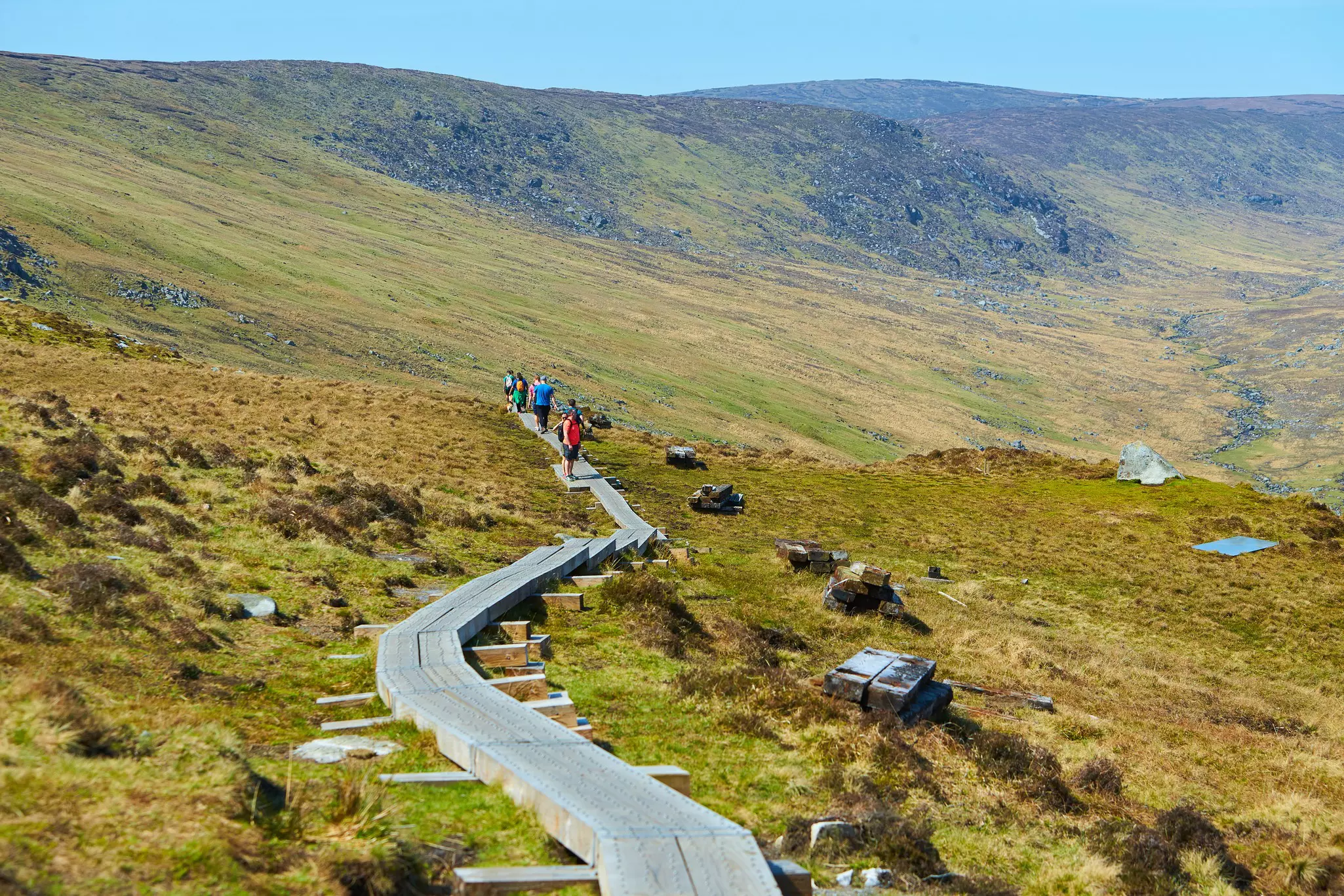 Group of hikers on mountains Glendalough at early spring