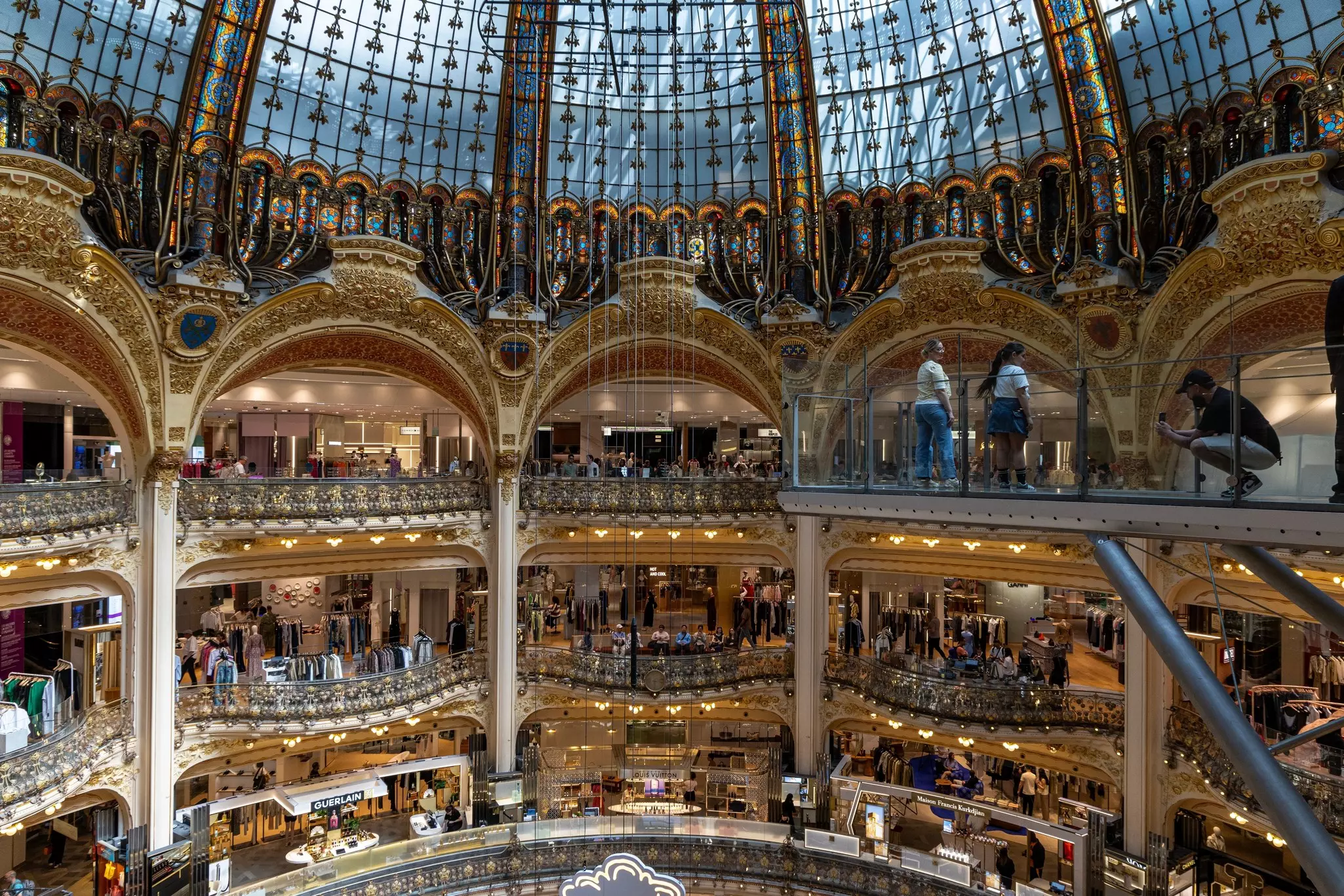 Galeries Lafayette. Architectural dome over a building with multi-colored stained glass windows. Paris, France.,