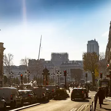April 2019: Traffic in Paris near the damaged Notre Dame, which is is half-covered with scaffolding after a major fire in April 2019.
1197085659
French Culture, History, Transportation, Cathedral, Old, No People, 2019, Travel Destinations, Horizontal, Built Structure, Passenger Craft, Facade, Mode of Transport, Back Lit, Polarizer, Photography, Notre Dame de Paris, Outdoors, Public Transportation, Side Lit, Famous Place, International Landmark, Day, Sky, Car, Town, City Life, Church, Europe, Tourism, Capital Cities, City Street, Stationary, Street, France, Traffic, Travel, Building Exterior, Paris - France, Cityscape, Architecture, Scaffolding, Road, Tower, Tourist, Sailing, Urban Skyline, City, Sun, Ile de la Cite, Ferry, Winter