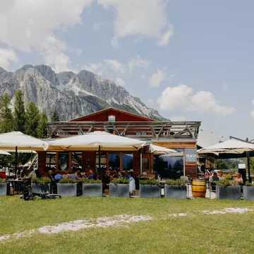 Cortina d'Ampezzo, Italy. June 2025. ..Masi Wine Bar, located in Col Druscié (1778m). The Freccia nel Cielo (Arrow in the Sky) lift, which reaches the top of the Tofane Mountains and has three stops: Col Druscié at 1778m, Ra Valles at 2470m and Tofana di Mezzo at 3244m...Photo by Camilla Ferrari for Lonely Planet