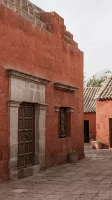 Red buildings with rounded tile roofs.