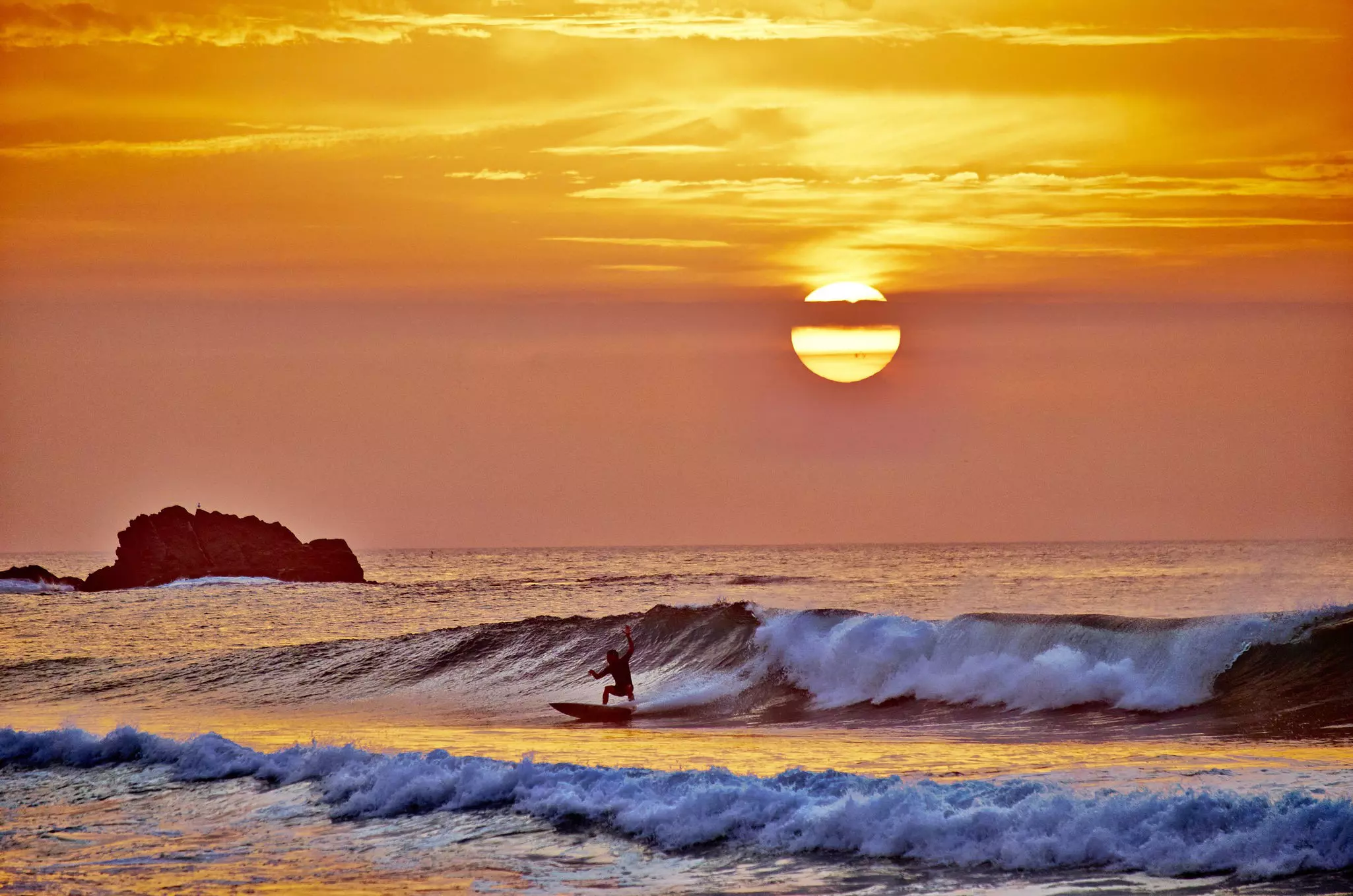 Portugal, Algarve, Sagres, Cordoama Beach, sunset above the Atlantic Ocean.