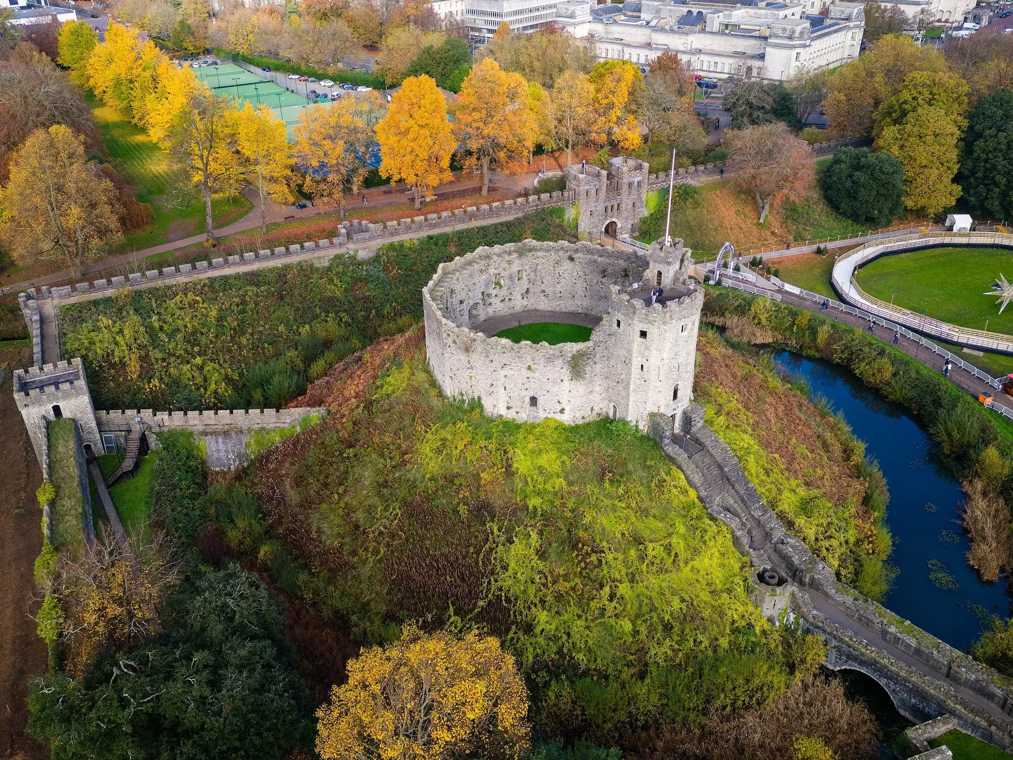 Aerial view of Cardiff Castle and Bute Park with colourful autumn leaves, Cardiff, Wales.