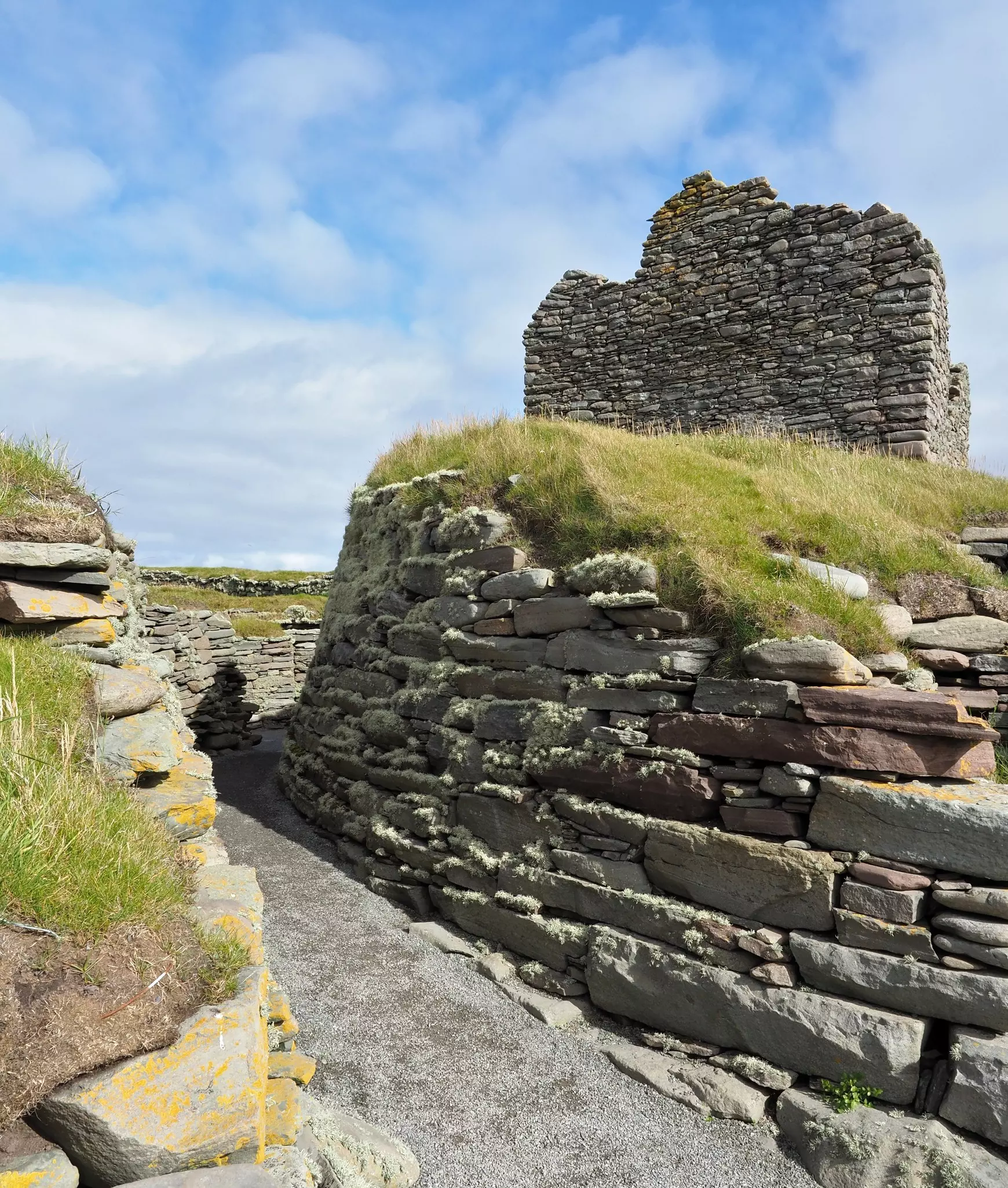 Stone walls and the ruins of an ancient tower