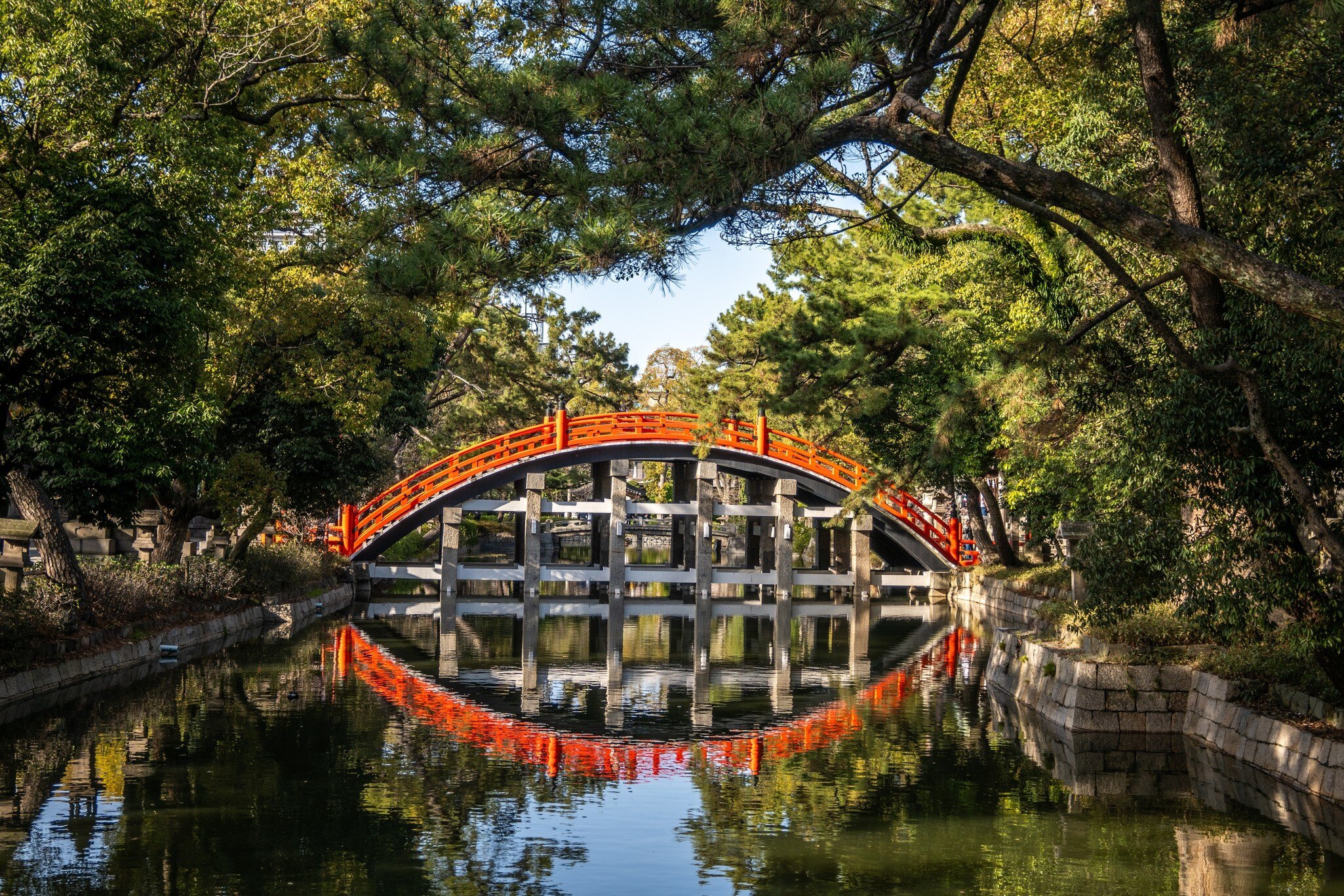 Red Sumiyoshi Taisha Sorihashi Bridge is a picturesque red bridge with a high arch that spans a tranquil pond in Osaka, Japan., License Type: media, Download Time: 2026-05-28T19:45:07.000Z, User: LP_NZhan, Editorial: false, purchase_order: 65050 - Digital Destinations and Articles, job: App Content, client: Lonely Planet App, other: Nadine Zhan