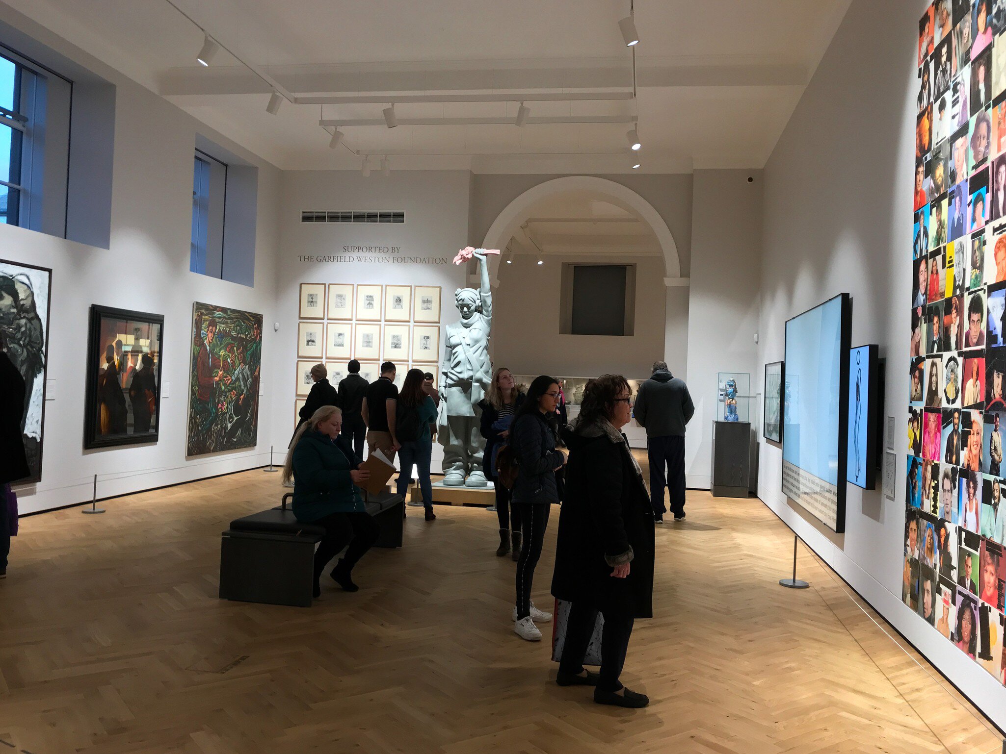 Aberdeen, Scotland / UK - December 8, 2019: Interiors of the Art Gallery in Aberdeen. Visitors standing in the middle of one of the art gallery halls looking at different photos placed on the walls., License Type: media, Download Time: 2026-03-02T19:59:36.000Z, User: LP_YKhanna, Editorial: true, purchase_order: 65050 - Digital Destinations and Articles, job: LP, client: App Content, other: Yuvraj Khanna