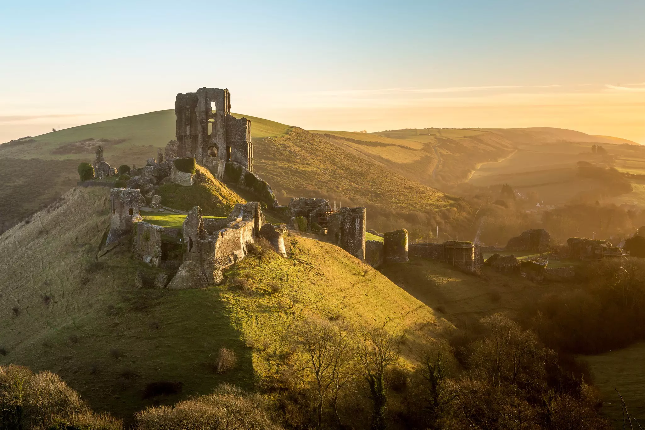 Though it may be in ruins, Corfe Castle remains a beautiful sight in the Dorset countryside. Kevin Standage/Shutterstock