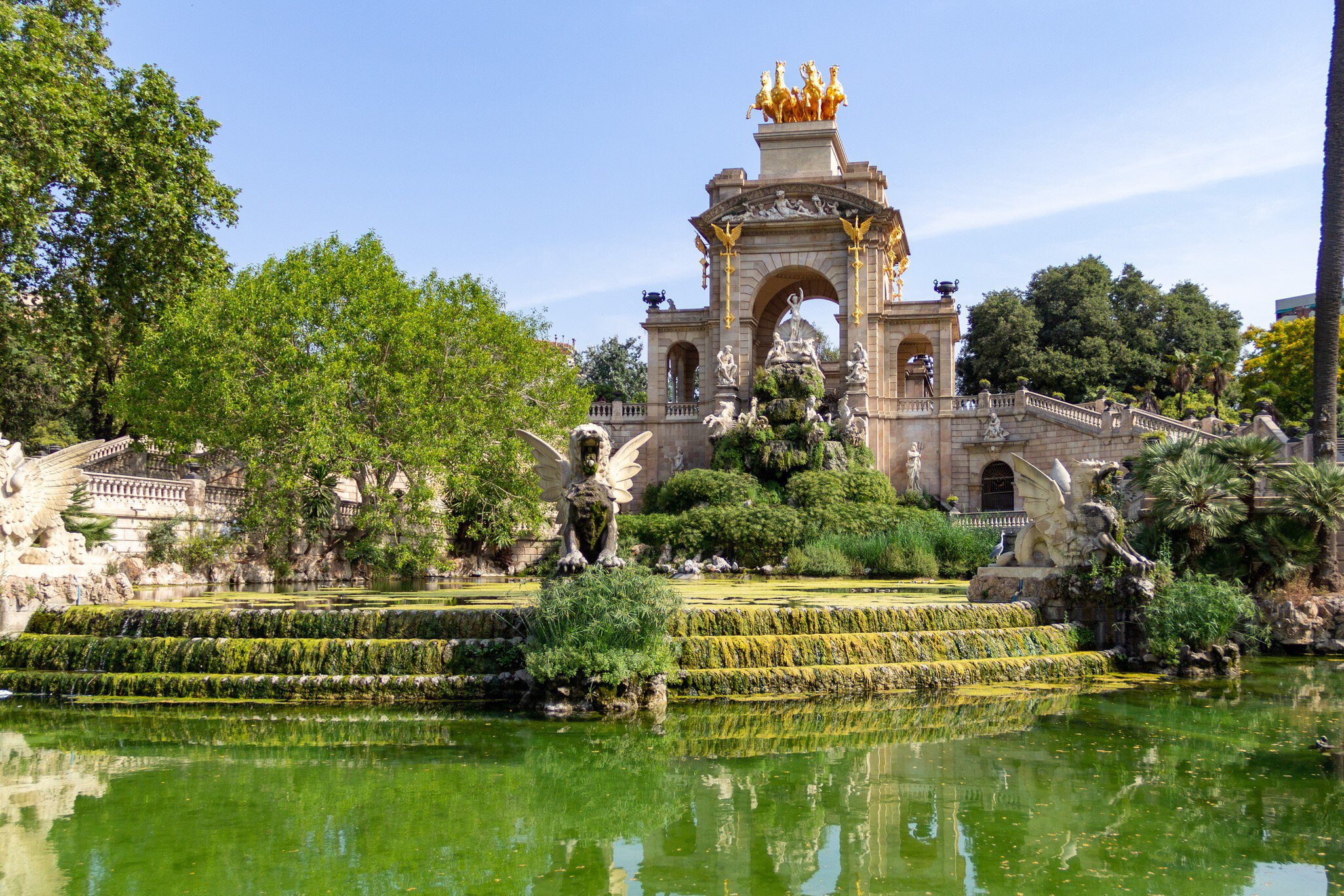 The old Cascada waterfall fountain in Parc de la Ciutadella during a sunny summer day in Barcelona, Spain.