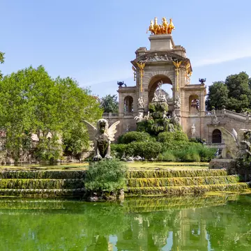 The old Cascada waterfall fountain in Parc de la Ciutadella during a sunny summer day in Barcelona, Spain.