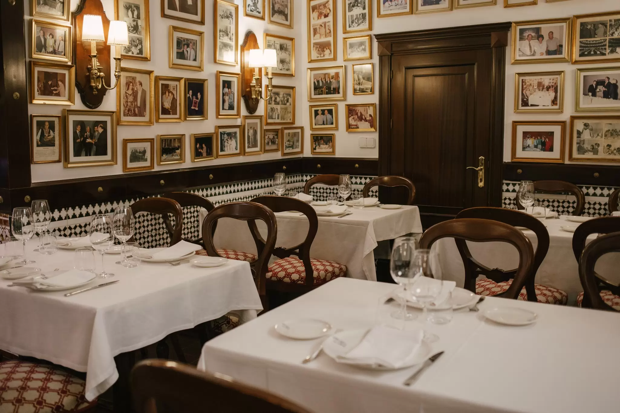 Set tables in the inviting dining room at El Faro de Cádiz in Cádiz, Spain.  