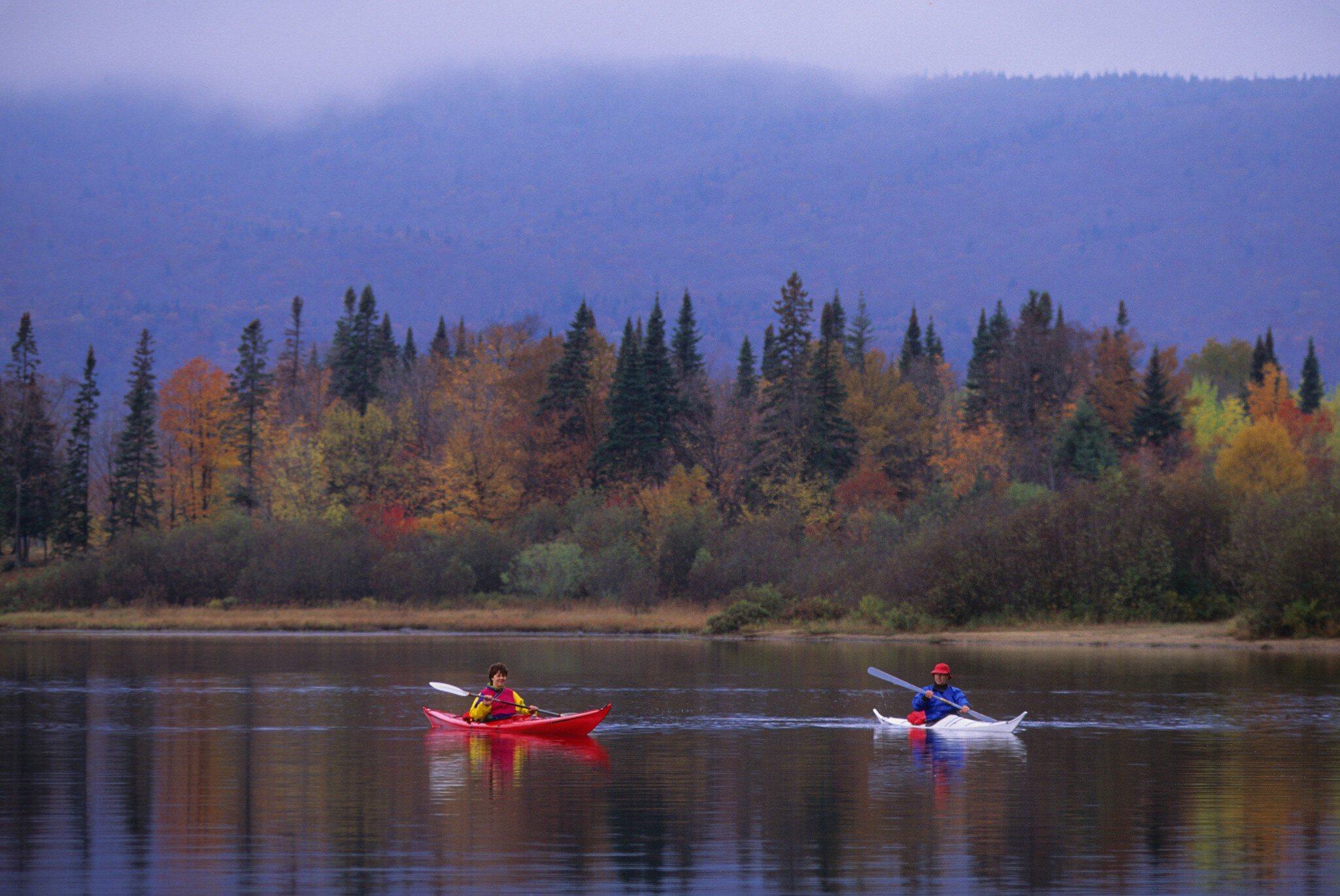 QUEBEC, CANADA - 1992/10/15: People kayaking in the fall on Lake Lac-Monroe, Mont-Tremblant National Park, in the Laurentians in Quebec Province, Canada. (Photo by Wolfgang Kaehler/LightRocket via Getty Images)
ACTIVITIES, ACTIVITY, AUTUMN, AUTUMN COLORS, AUTUMN SCENE, AUTUMN SCENES, CANADA, FALL, FALL COLOR, FALL COLORS, FALL SCENE, FALL SCENES, FOREST, FORESTS, KAYAK, KAYAKER, KAYAKERS, KAYAKING, KAYAKS, LAC-MONROE, LAURENTIAN, LAURENTIAN QUEBEC, MONT-TREMBLANT PARK, NORTH AMERICA, PEOPLE, PEOPLE WORLDWIDE, QUEBEC, QUEBEC CANADA, QUEBEC PROVINCE, RECREATIONAL, RECREATIONAL ACTIVITIES, RECREATIONAL ACTIVITY, RECREATIONAL SPORT, RECREATIONAL SPORTS, REFLECT, REFLECTING, REFLECTION, REFLECTIONS, SCENIC, SCENICS, SEASON, SEASONS, TREE, TREES, WATER, WATER ACTIVITIES, WATER ACTIVITY, WATER SPORT, WATER SPORTS, NORTH AMERICAN, Canadian, Mont-Tremblant National Park, Lake, topics, topix, bestof, toppics, toppix