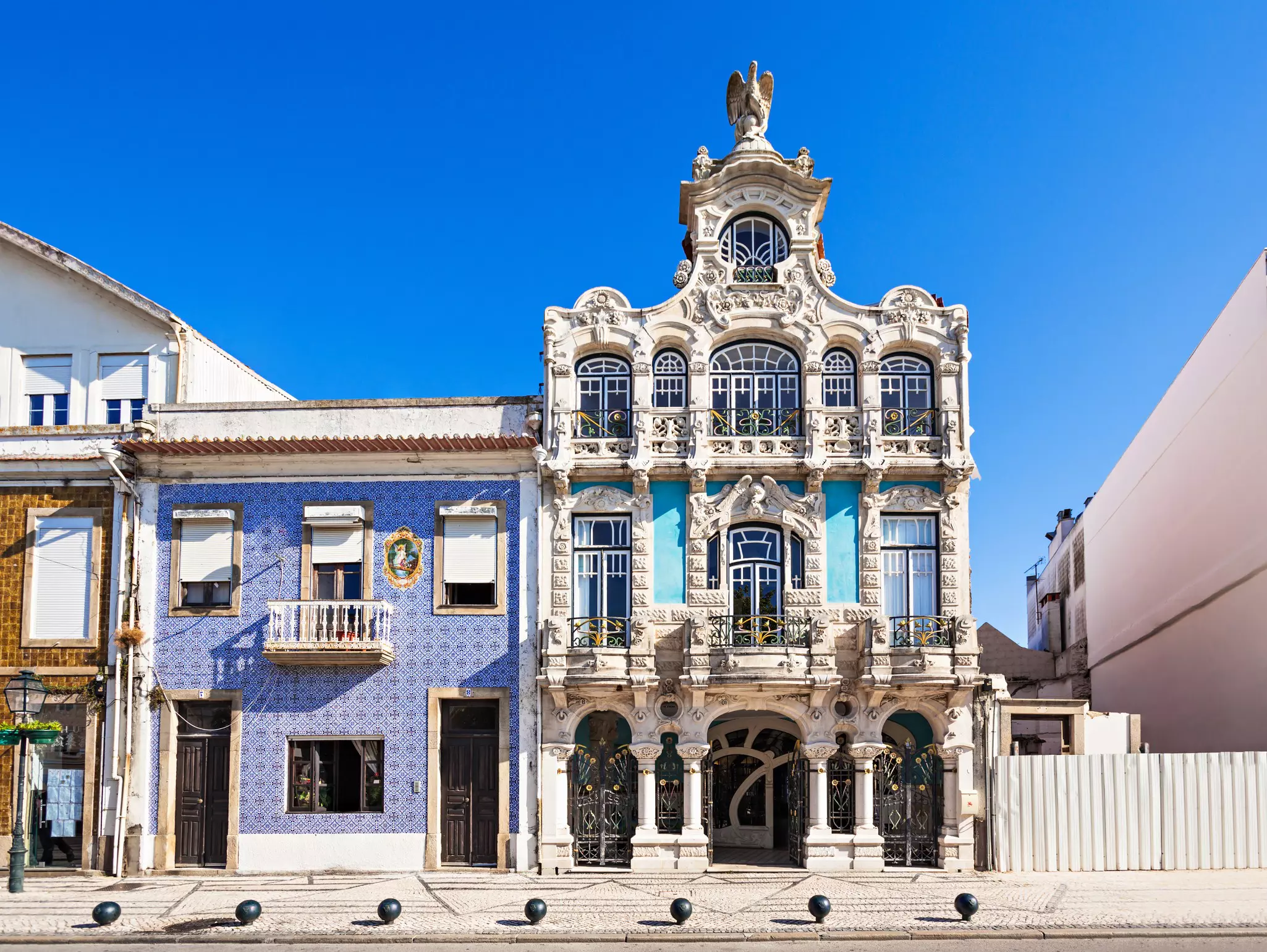 Ornate exterior of a museum building with detailed columns and wrought-iron features over balconies