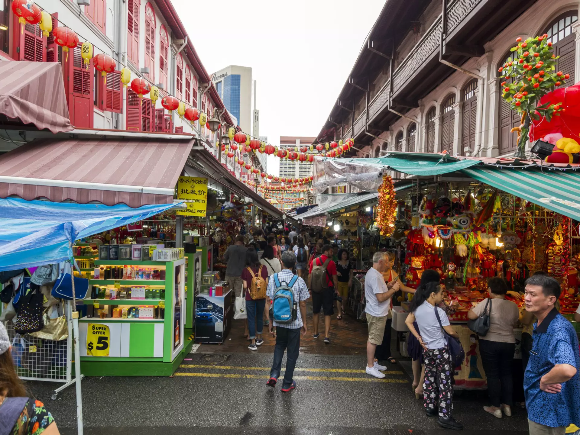 A traveller walking through Chinatown. Tapsiful / Getty