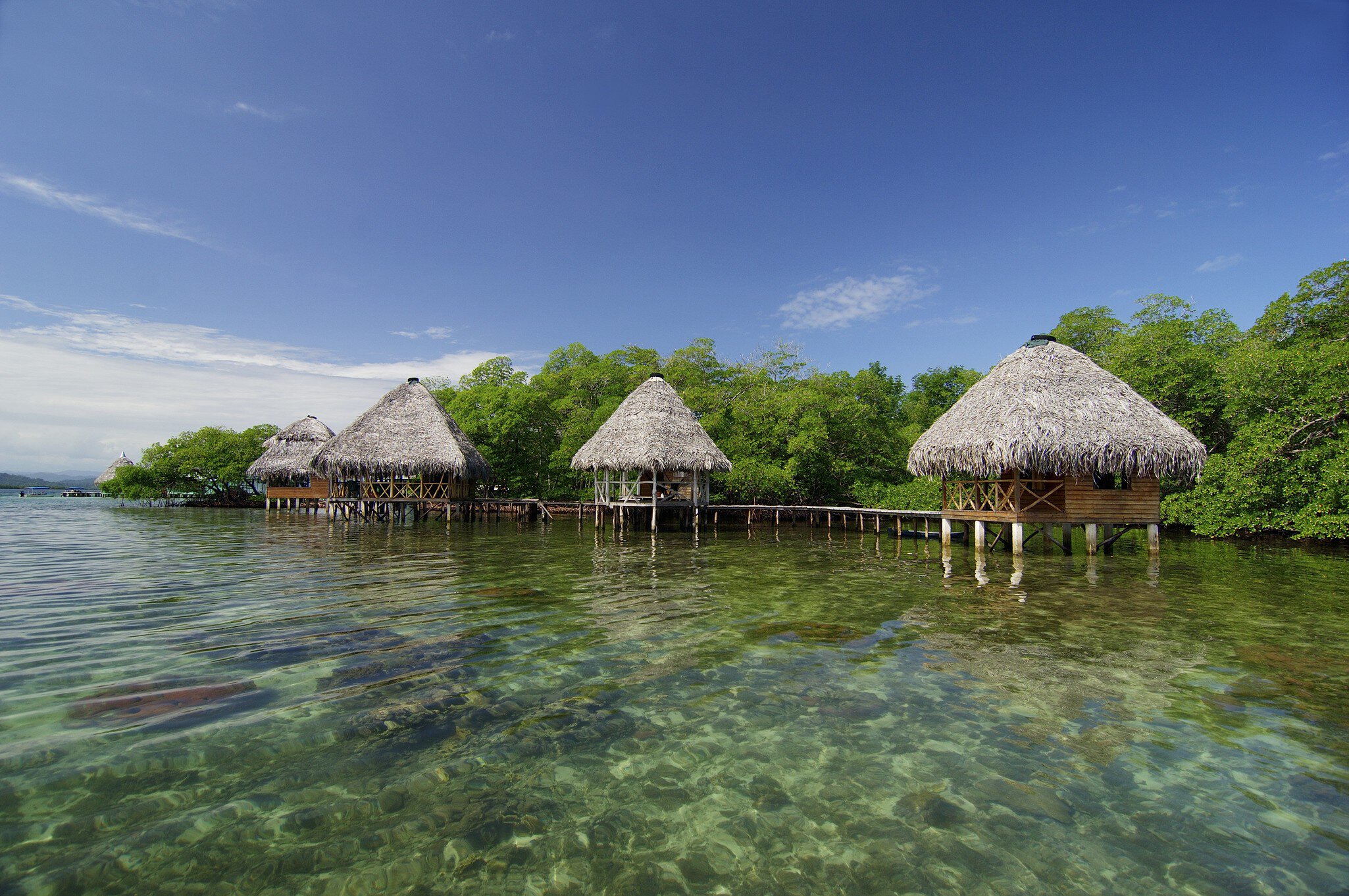 Cabins on the tropical waters of Coral Key, Bastimentos Marine Park.
