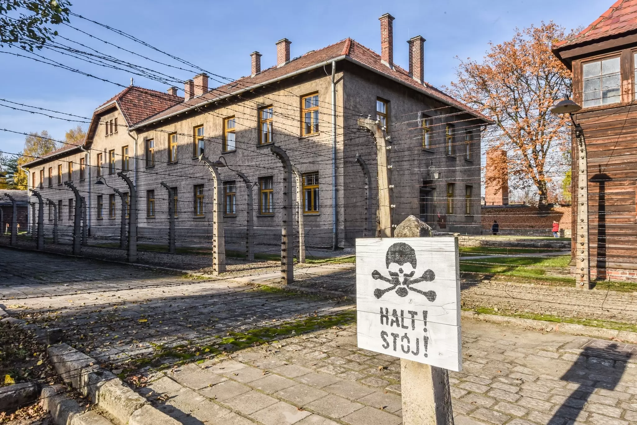A wooden warning sign for prisoners at Auschwitz-Birkenau concentration camp in Poland.