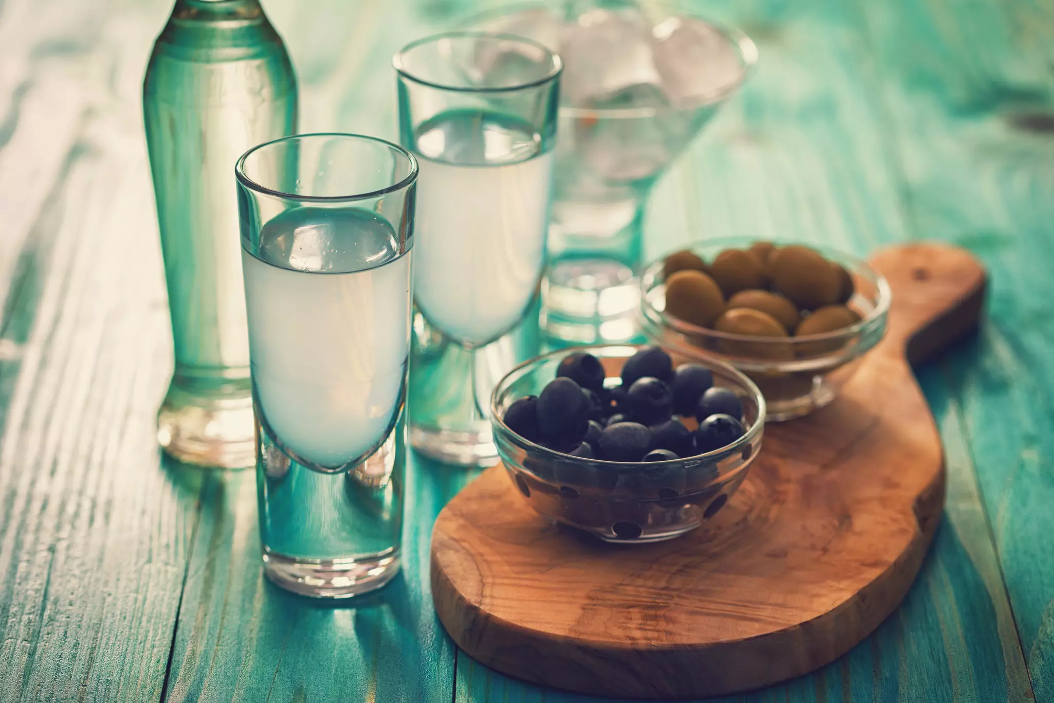 Ouzo, a strong, anise-flavored liquor is served with water and ice and enjoyed with seafood © kajakiki / Getty Images