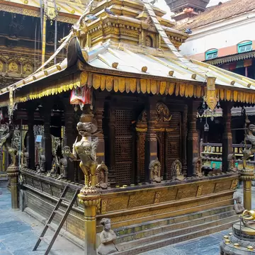 Nepal, Lalitpur - May 10, 2019: Hiranya Varna Mahavihar (The Golden Temple) buildings exterior in a sunny day in Lalitpur city, Nepal. Soft focus. Religious architecture theme.