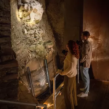 Visitors look at ruins at DOMunder in Utrecht, Netherlands.