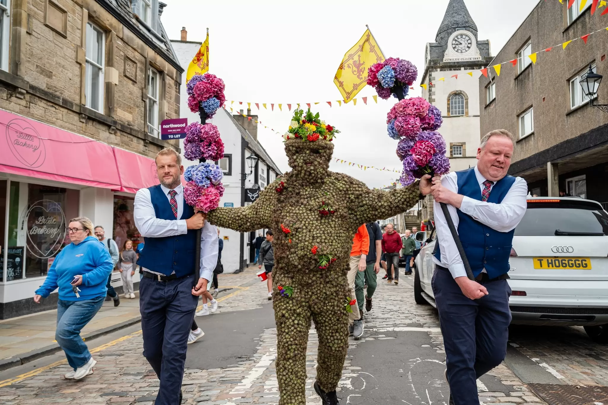 The decorated Burryman being led down the street in South Queensberry. Euan Cherry/Shutterstock