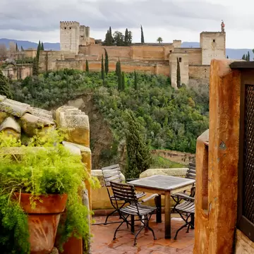 A European style table setting on a patio overlooking the Alhambra in Granada, Spain                           , License Type: media, Download Time: 2026-02-16T16:31:43.000Z, User: LP_YKhanna, Editorial: false, purchase_order: 65050 - Digital Destinations and Articles, job: LP, client: App Content, other: Yuvraj Khanna