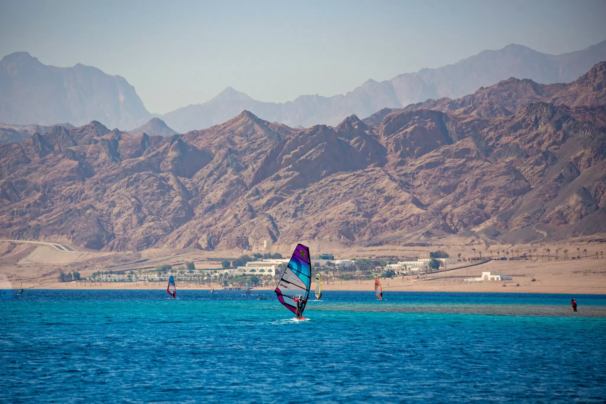 Windsurfing in Dahab, Egypt. Sun_Shine/Shutterstock