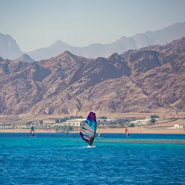 Windsurfing in Dahab, Egypt. Sun_Shine/Shutterstock