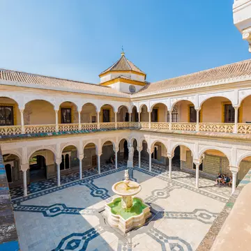 SEVILLE, ES - JULY 27, 2017: The Casa de Pilatos is a palace which combines the Italian Renaissance and Spanish Mudejar styles. It is considered the prototype of an Andalusian palace.; Shutterstock ID 1007589019;