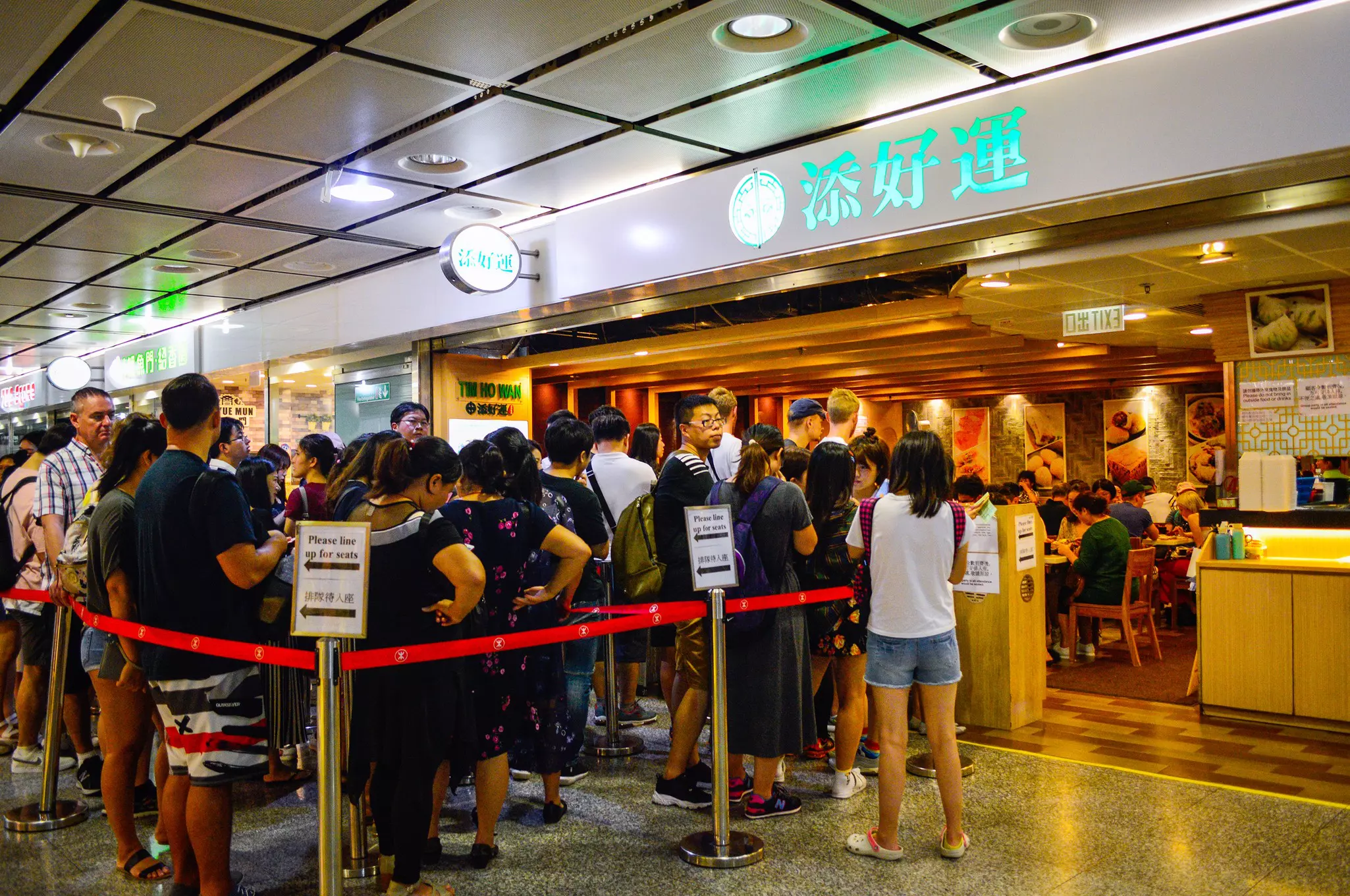 Diners waiting in a queue at the famous Tim Ho Wan restaurant in Central, Hong Kong.
