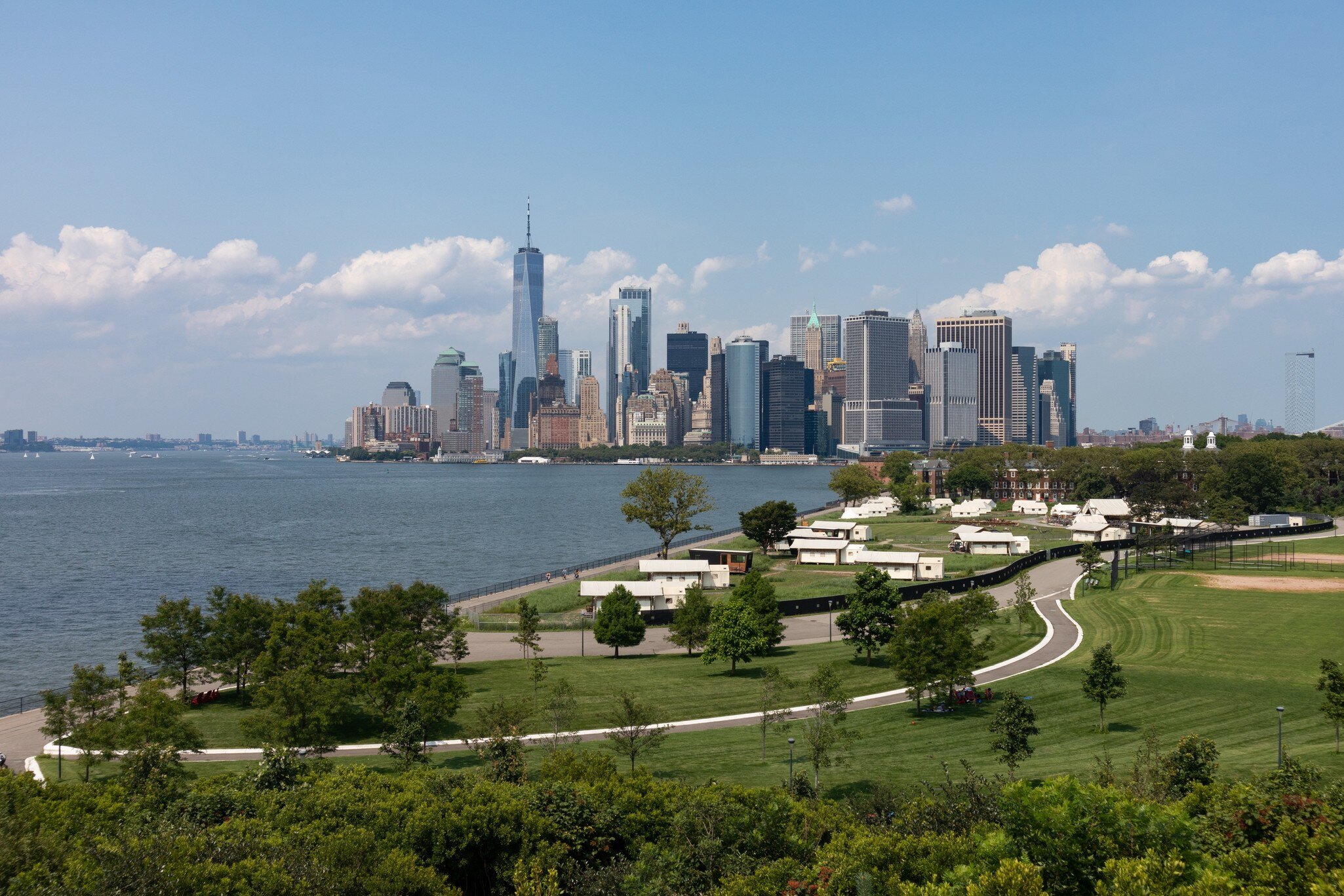 Lower Manhattan Skyline view and Luxury Camping Tents on Governors Island in New York City during the Summer, License Type: media, Download Time: 2025-11-26T20:58:49.000Z, User: LP_YKhanna, Editorial: false, purchase_order: 65050 - Digital Destinations and Articles, job: LP, client: App Content, other: Yuvraj Khanna
