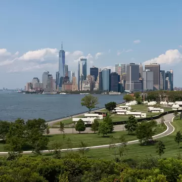Lower Manhattan Skyline view and Luxury Camping Tents on Governors Island in New York City during the Summer, License Type: media, Download Time: 2025-11-26T20:58:49.000Z, User: LP_YKhanna, Editorial: false, purchase_order: 65050 - Digital Destinations and Articles, job: LP, client: App Content, other: Yuvraj Khanna