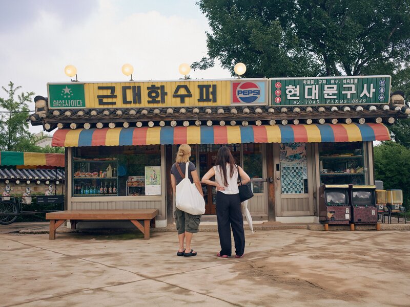 Jongno District, Seoul, South Korea. July 2026. Visitors viewing The National Folk Museum of Korea, where replicas of liquor stores, barber shops, and schools from the 50s are able to be walked through and experienced.