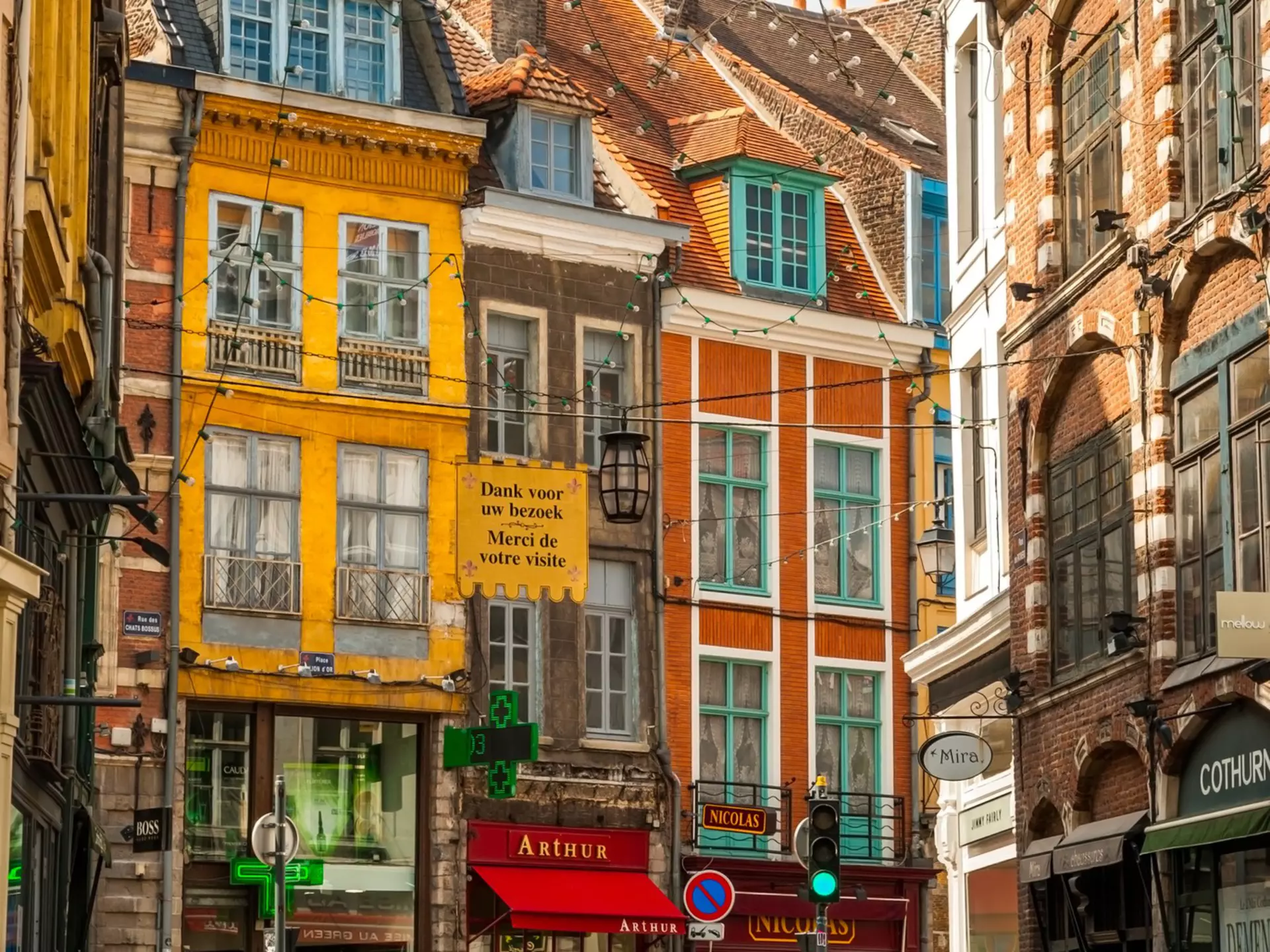  Busy street in Lille's old town with shoppers on a sunny summer day 