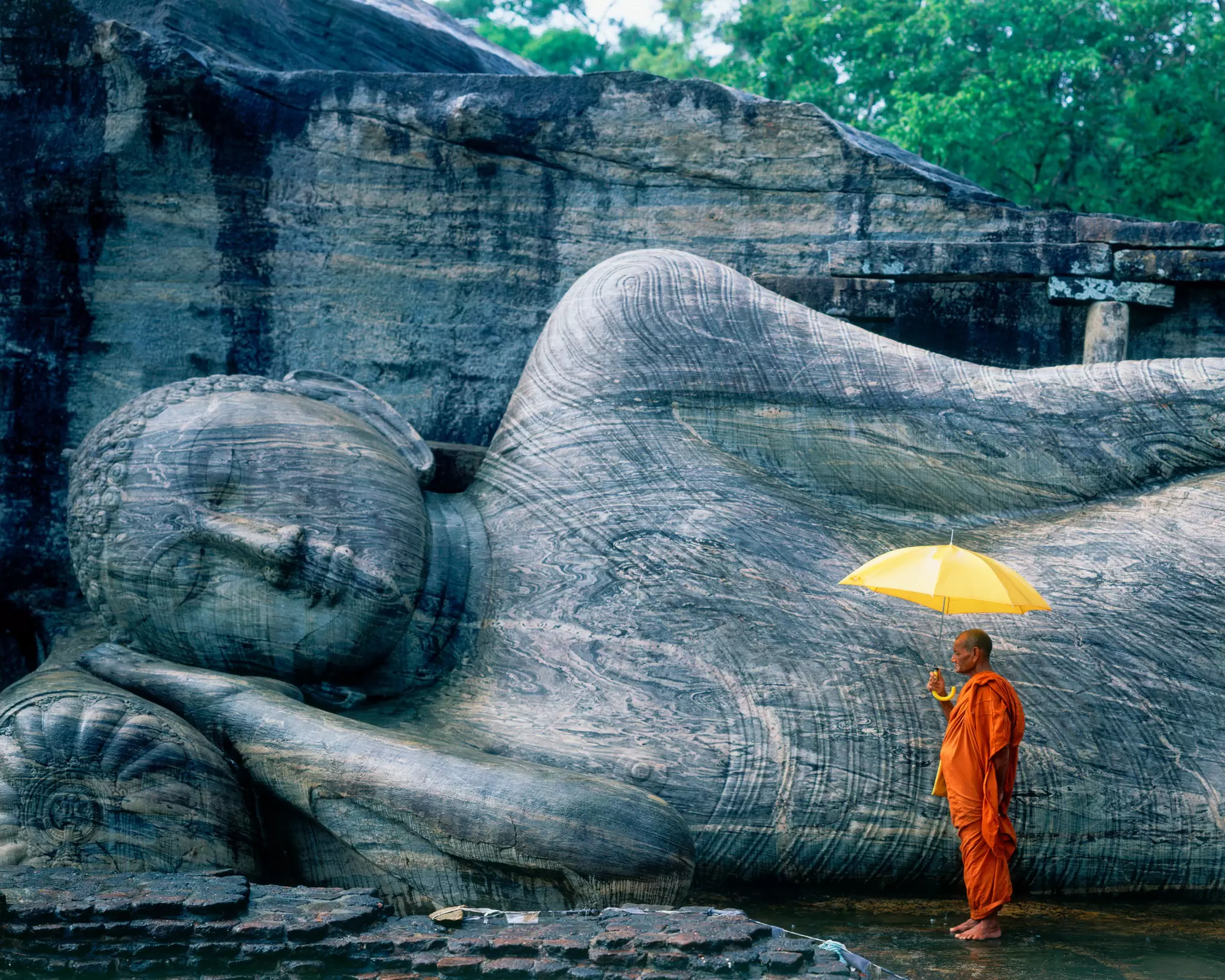 Buddhist monk at the Gal Vihara in Sri Lanka. Hugh Sitton/Getty Images