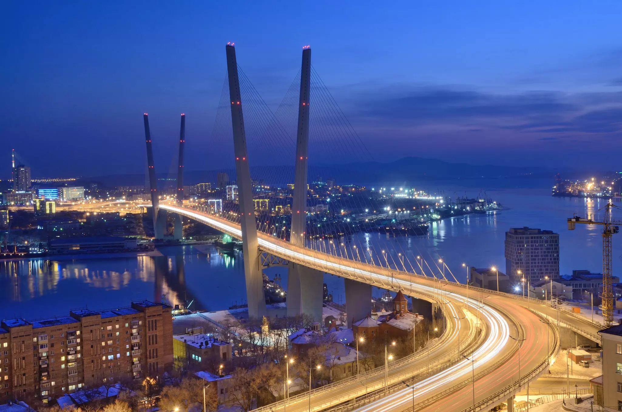 The bridge across the Golden horn bay in Vladivostok at night.