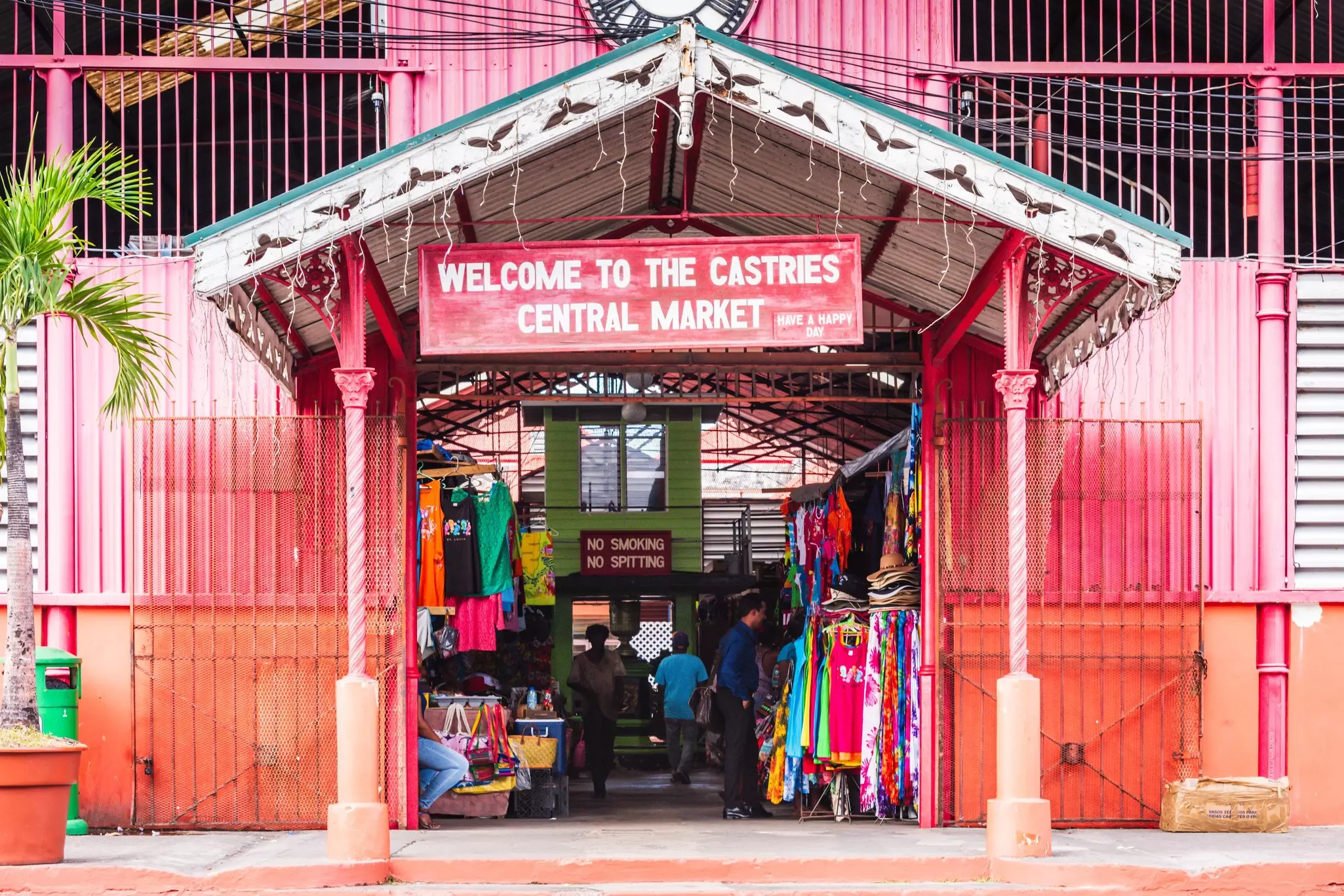 The pink-painted exterior of a covered market.