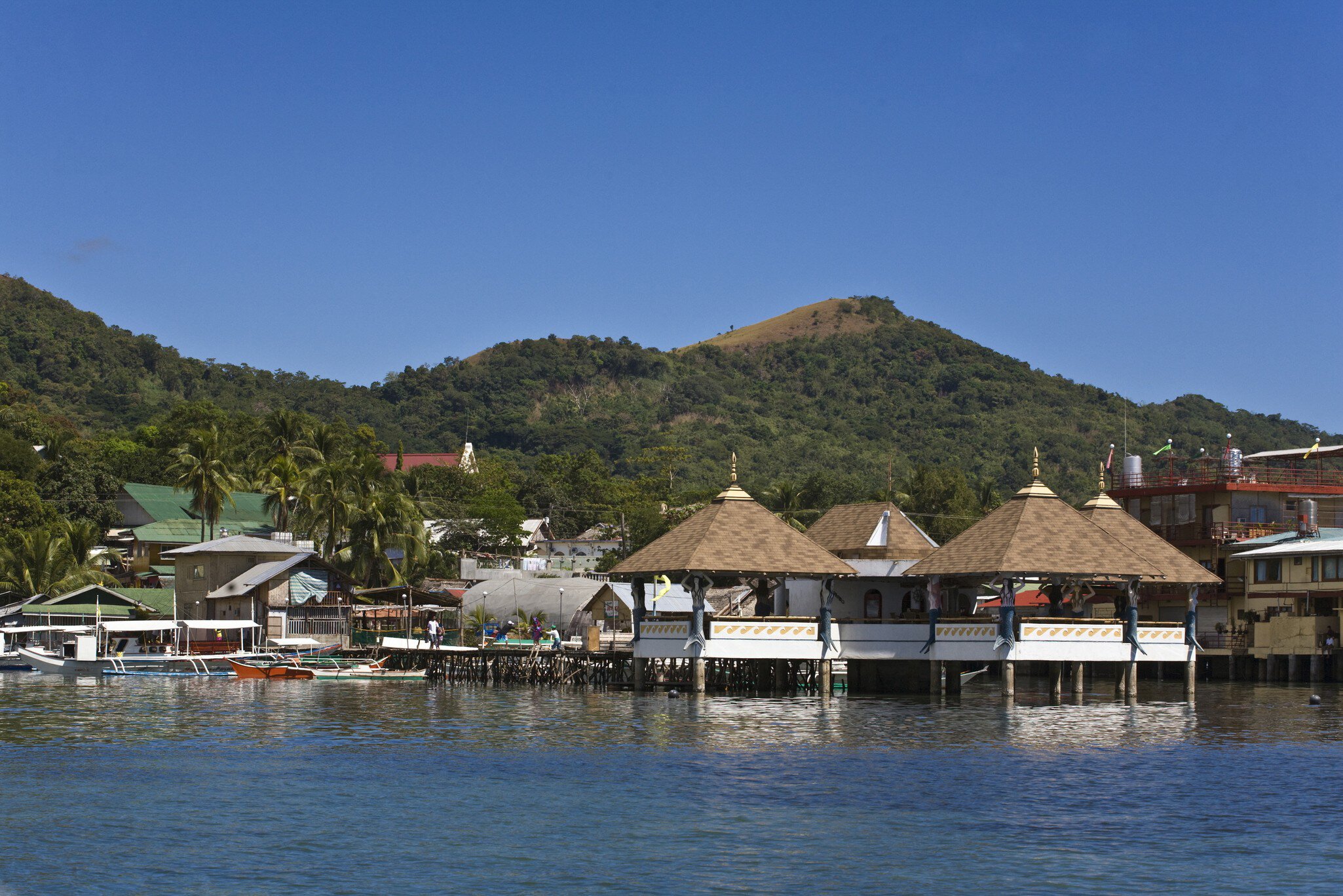 A Restaurant And Bar In Coron Town On Busuanga Island In The Calamian Group, Philippines. (Photo By: Education Images/UIG via Getty Images)
Asia, Philippines, island, ocean, sea, restaurant, bar, boat, tropical, water's, edge, bay, horizontal, Asiatic, eastern, citizens, Philippine, individuals, islands, peoples, oceanic, persons, oceans, seas, boats, seascape, seascapes, Philippine, Islands, digital, capture, Pacific, ocean, South, Pacific, fishing, village, Island, life, Coron, Bay, Busuanga, Islands, Busuanga, Island, group, small, boat, tourist, destination, tropical, vacation, port, town, tourist, town, Busuanga, Busuanga, Island, Coron, Town, Calamian, Group, Filipino, outrigger, rural, life