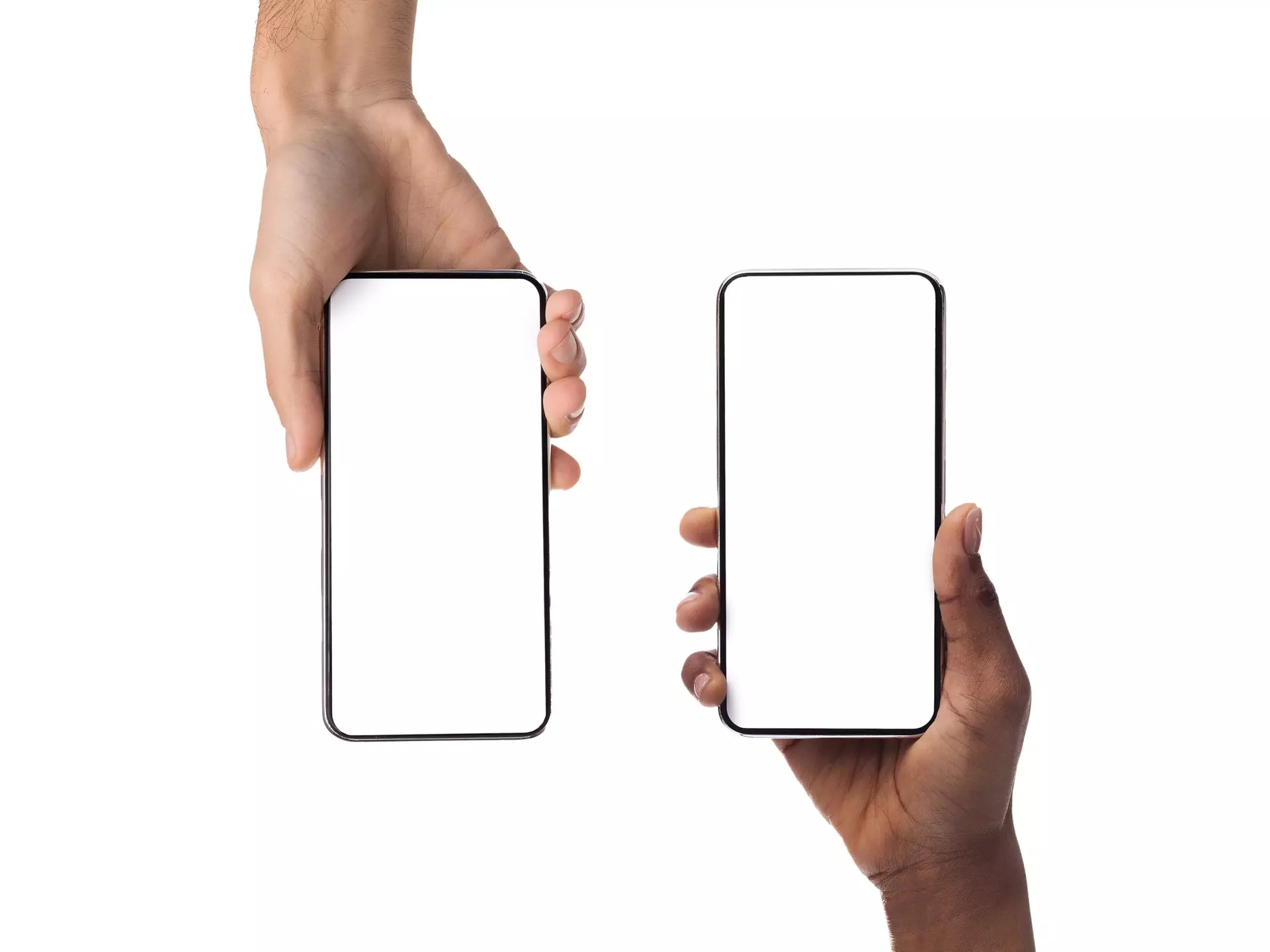 Closeup of female and male hands holding 2 smartphones with white empty screen, showing using devices, transfer data, sharing media. Two vertical gadgets with copy space, mock up, studio background; Shutterstock ID 2086636222; purchase_order:56530 - Guidebooks; job:Global Publishing-WIP; client:Budapest & Hungary 10.; other:Ania Lenihan
2086636222