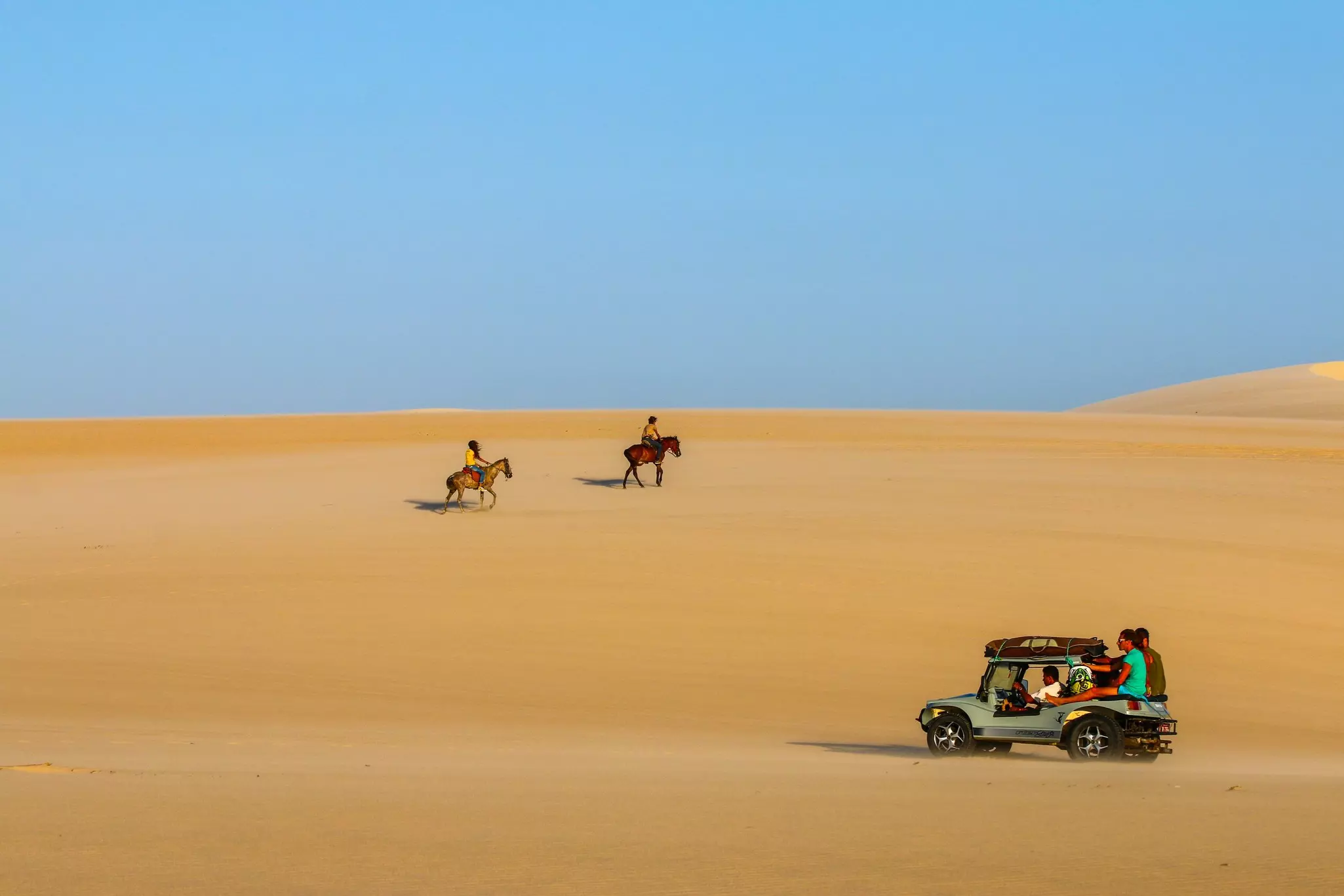 Brazil, Jericoacoara - Horse Riding and buggy in the dunes.