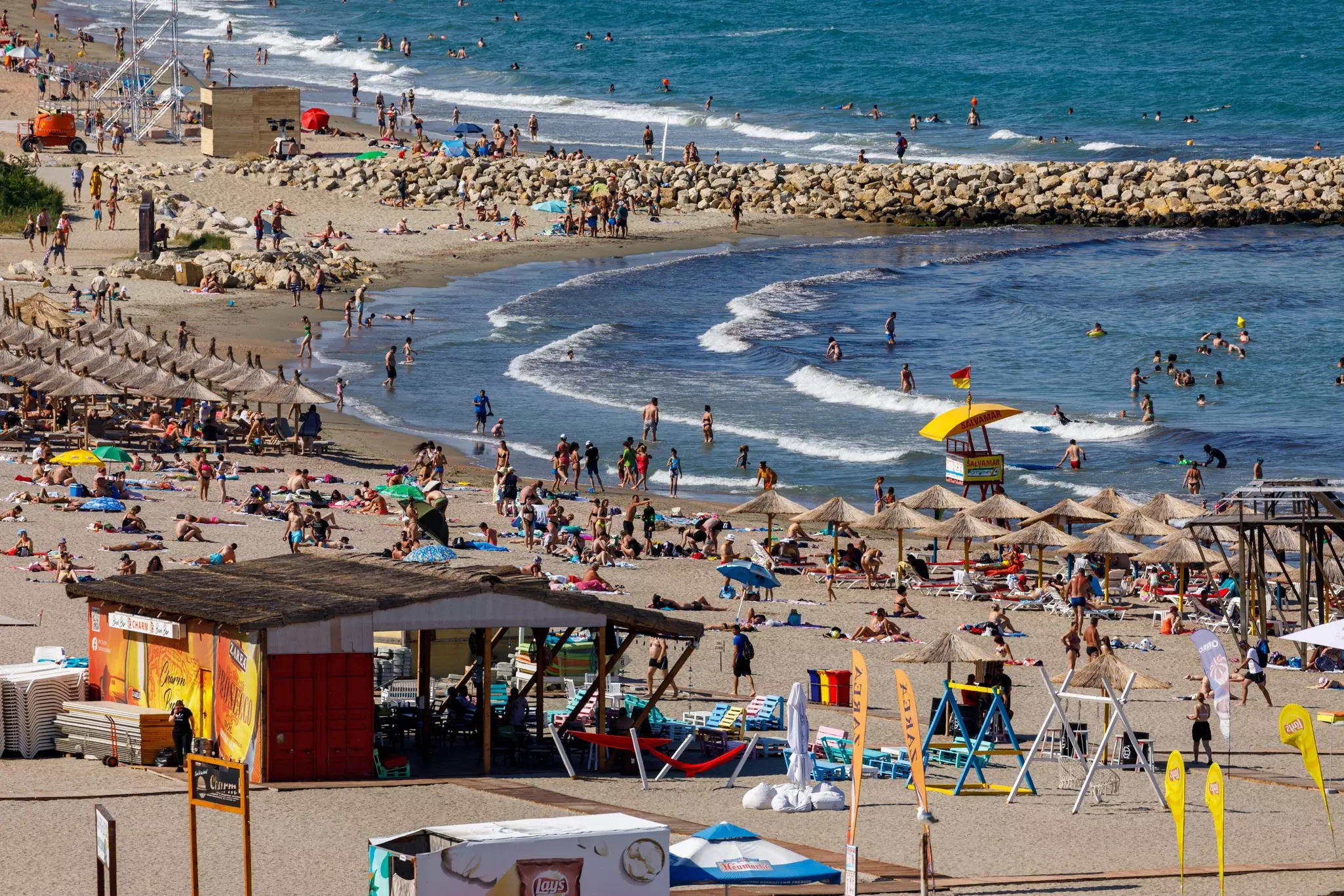 Holidaymakers on the beach at Constanta on the Black Sea coast of Romania.
