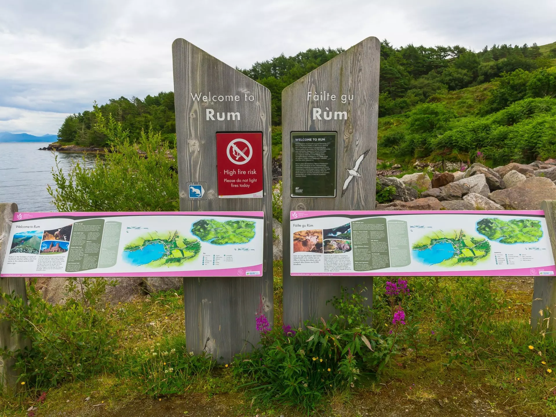 Isle of Rum, Inner Hebrides, Scotland.  July 14, 2023.  Colourful Welcome to the Isle of Rum information sign placed at the Pier for visitors arriving on the island.  Horizontal.  Copy space, License Type: media, Download Time: 2024-11-13T02:49:03.000Z, User: claramonitto, Editorial: true, purchase_order: 56530 - Guidebooks, job: Global Publishing-WIP, client: Scotland 13, other: Clara Monitto