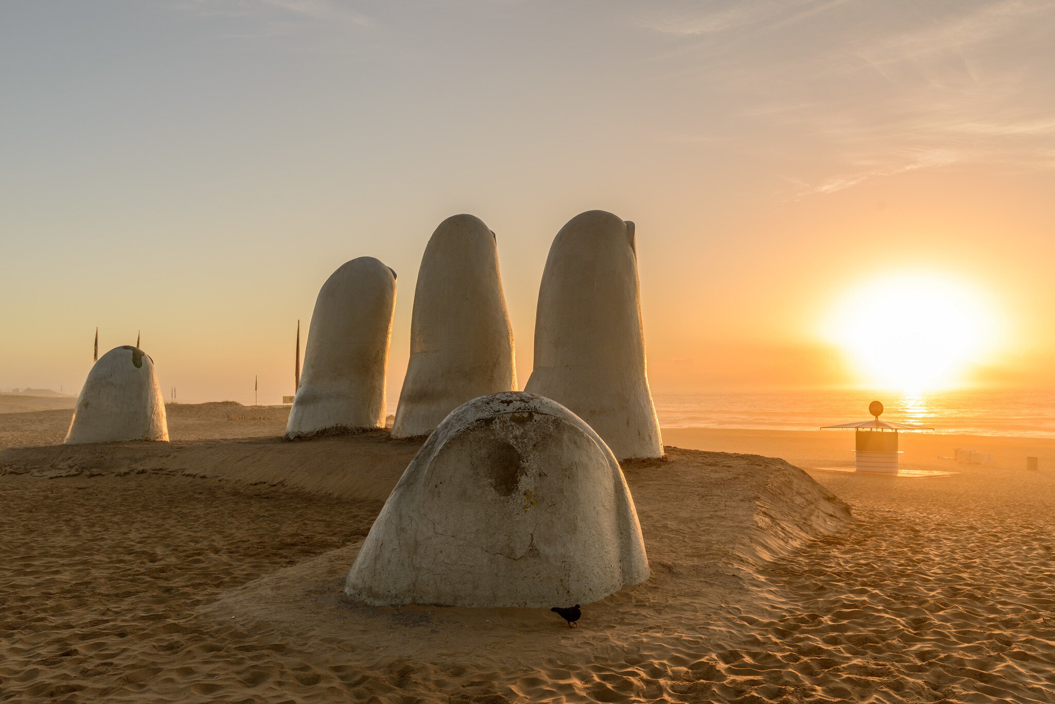 Famous sculpture 'Mano de Punta del Este' by Mario Irarrázabal at sunrise