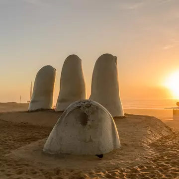 Famous sculpture 'Mano de Punta del Este' by Mario Irarrázabal at sunrise